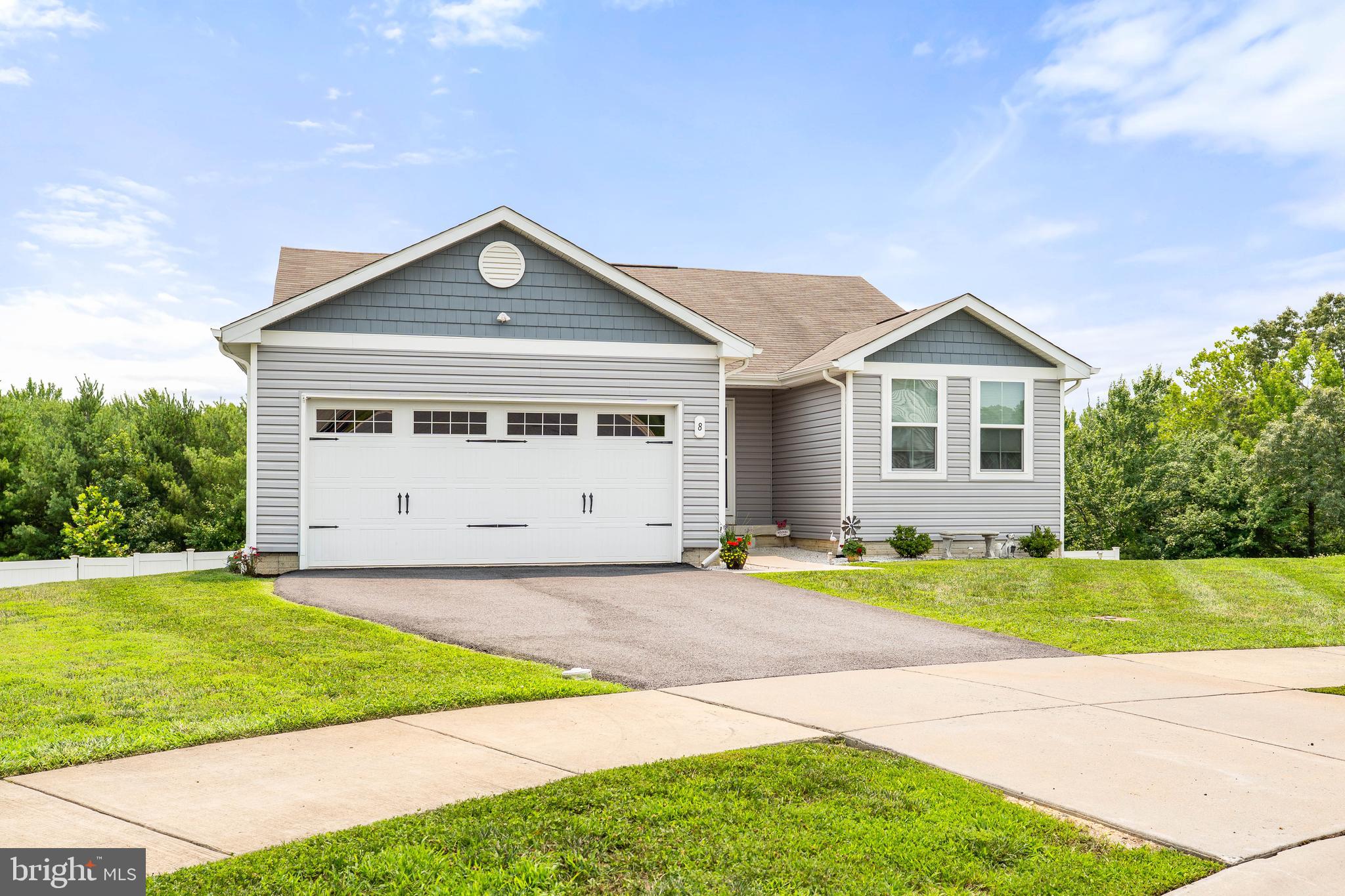 Like new rancher in Ridgely Forest!  Why wait for new construction when you can have this  lightly lived in and meticulously maintained home! Features included OWNED solar panels that provides an electric bill between $9-$10/month! Other features include 3 bedrooms and 2 full baths.  The owners suite includes a large walk-in closet and en suite bath. Open concept floor plan.  Kitchen with upgraded soft close cabinets, granite counters, tile backsplash, and stainless appliances.  Fully fenced back yard with vinyl privacy fence and large composite deck off the kitchen. Walkout basement has rough-in for full bath. 2 car attached garage.  Community pool and pavilion included in HOA fees!