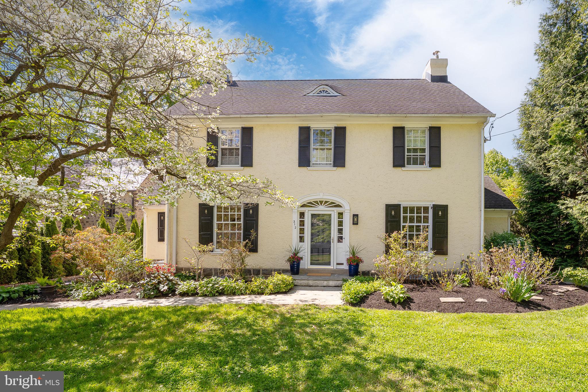 Nestled on a beautiful tree-lined street is one of Radnor Townships most sought after "walk to Wayne" neighborhoods! 312 Windsor Avenue is a charming residence that perfectly blends character, comfort and convenience. This 5 Bedroom, 3 full & 1 half  Bath home welcomes you with inviting spaces and abundant natural light throughout. The Foyer welcomes you into this warm home with hardwood floors and wainscoting. To the right is the large Living Room with an oversized fireplace,  a classic mantel, hardwood floors and crown molding. The Dining Room has hardwood floors, deep window sills and a built-in cabinet. The Dining Room leads into an updated Kitchen with wood cabinetry, stainless appliances and features the original Butler's Pantry.  The kitchen with its eat-in area seamlessly opens to a truly exceptional Family Room, the heart of the home, with its dramatic cathedral ceiling, skylights and walls of sun filled windows. This stunning space creates an airy, light filled atmosphere, ideal for both everyday living and effortless entertaining. Just off the Family Room is a cozy Den and/or Office with a brick floor, radiant heat, built-ins,  and a Powder Room adjacent. The Second Floor leads to the Primary Bedroom with hardwood floors, deep closets and an Ensuite Bathroom with a tub/shower. There are two additional Bedrooms with hardwood floors and a Hall Bath to complete the Second Floor. The Third Floor provides two additional Bedrooms with a  Hall Bath in between. The Basement is unfinished with a washer, dryer and a set tub as well as Bilco doors to the outside.  An additional Basement level with high ceilings is waiting to be finished for additional living space. Outside the home offers a private and quiet retreat to entertain and play! Thoughtfully designed and rich in character, this home offers a wonderful flow that enhances both its charm and livability. Its location is superb,  just a short stroll to the shops, restaurants and train in the vibrant town of Wayne and within the award winning Radnor School District. This home offers the very best of Main Line living. A true gem in an unbeatable location. Don't miss this special opportunity. Welcome Home!