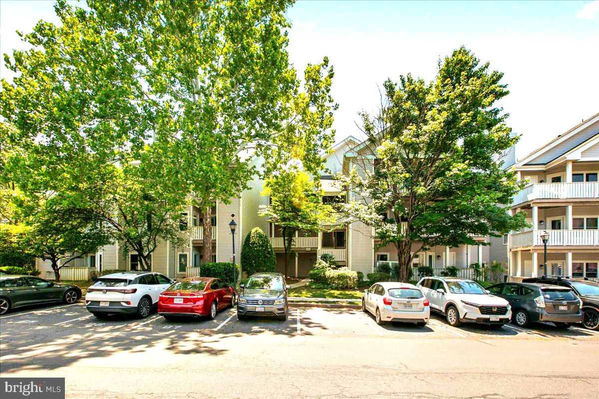This gorgeously renovated ground-level condo offers modern finishes and is ready to move in, in Centreville's premier Sanderling community. Featuring fresh interior paint and brand-new appliances, the residence boasts an open layout highlighted by durable vinyl hardwood flooring and a bright living area with a wood-burning fireplace.

The gourmet kitchen is equipped with contemporary white cabinets, granite counters, and stainless-steel appliances. A newly installed, stackable in-unit washer and dryer provides ultimate convenience.

Step outside onto the expansive balcony to enjoy beautiful, unobstructed views of the community pond. The property also features a generous separate storage/utility room.

Great added value: the Condominium Owners Association (COA) is actively upgrading the building with new windows, new siding, and freshly stained balconies. Residents enjoy access to a full suite of amenities, including an outdoor pool, clubhouse, fitness center, and lakeside walking paths. Superb commuter location with quick access to Rt. 29, Rt. 28, I-66, and Fairfax County Parkway, close to local shopping and dining hubs. Exceptional value—schedule your showing today!