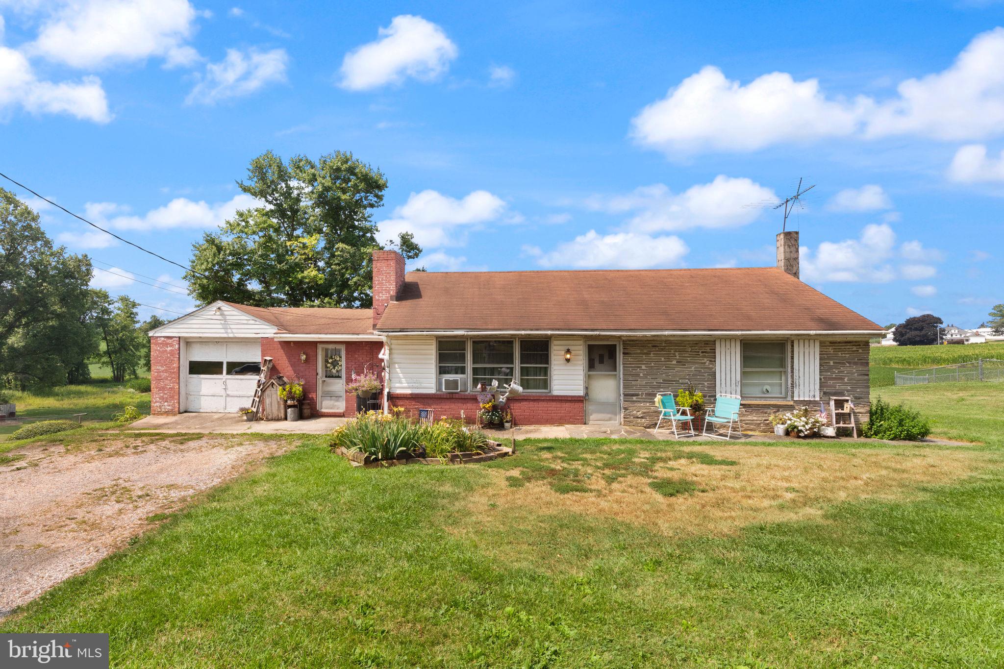 Welcome Home to this unique Rancher here in Hampstead, MD. The home has an absolute ton of potential as a 2 unit, or a single family dwelling. The original home has a 1 car attached garage with a separate garage space down below, a charming breezeway/mudroom, a large kitchen with wooden cabinetry/plenty of storage space/and lots of natural light, family room off of the kitchen with woodburning fireplace and hardwoods under carpet, 2 spacious bedrooms with hardwood flooring, full bathroom, main level laundry room, and access to the unfinished basement and lower level garage space.  The 2nd unit addition is separately metered, has it's own dedicated outside entrance with ramp on the right side of the home, the family room is very large, has a full kitchen with hardwood cabinetry and dining area, 1 bedroom and full bathroom. There is also a huge 2 car garage beneath the addition with wrap around vehicle access coming from the front driveway. Bring your vision for this property, and book your showing today!
**DO NOT WALK ON REAR DECK - IT IS UNSAFE**