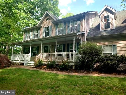 Beautiful colonial home with full front porch to enjoy the peace and quiet of this rural area in Madison County.  Home is freshly painted and ready to move  in condition with Hardwood floors on main level  and spacious open floor plan. Four Bedrooms and 2 full baths on the upper level.  Whole house generator, back deck, 2 car garage, unfinished basement,  and storage shed. Property is on 3.7 acres ...per county no hunting or gun shooting allowed.
