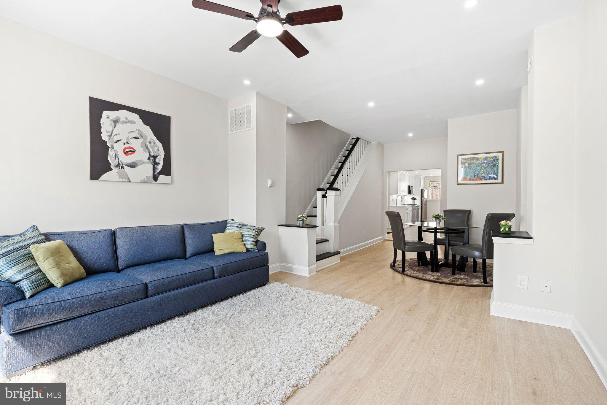 This beautifully renovated Manayunk home blends modern finishes with a thoughtful, functional layout across three spacious levels. Every inch has been upgraded — including new kitchens, bathrooms, flooring, drywall, recessed lighting, and reconfigured floor plans designed for contemporary living.

The first floor features a bright, open-concept living and dining area anchored by a sleek kitchen with stainless steel appliances, quartz countertops, and custom cabinetry. A convenient half bath and access to a private rear patio make this level perfect for everyday living and entertaining.

The second floor offers two comfortable bedrooms and a large full bathroom with a double vanity and glass-enclosed shower.

The entire third floor is dedicated to the primary suite — featuring a generous bedroom, dual closets with California Closet systems, a linen nook, a spacious en-suite bath, and direct access to a private roof deck with sweeping views of the Manayunk Bridge and Schuylkill River.

Additional highlights include:
– Built-in California Closet systems in every bedroom
– Freshly sealed basement with laundry and utilities
– Updated mechanicals and central air

Move-in ready and ideally located, this home offers turnkey convenience with elevated design — just minutes from Main Street, transit, and local trails.