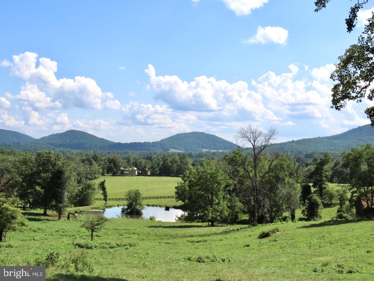 AN AMAZING FARM with THREE ADJOINING LOTS totaling 121 acres.   Stone walls, plank fencing,  two spring fed streams, ponds and truly fantastic views. PIECES MAY BE PURCHASED SEPARATELY,  EXCEPT THE 12 ACRES.

**********   Parcel 1.   Historic log home, restored in 1978, sits on 53 acres with a spring house, bank barn and pond.  Kitchen has big stone fireplace  with cooking iron, living room with stone fireplace, two sweet bedrooms up with two baths.    Rolling land with fantastic views, pastures, stone walls, scattered copses of trees.  

**********    Parcel 2.   Hilltop building site of 55 acres with nearly 360º views overlooking the rest of the farm. small pond, foothills and mountains to the east and south, and big handsome mountains and the Shenandoah National Park to the west. 

**********   Parcel 3.    A 12 acre lot,  with a fabulous elevated homesite.
 
**********  Taxes and Real Estate Assessment are based on Land Use Value for farming.