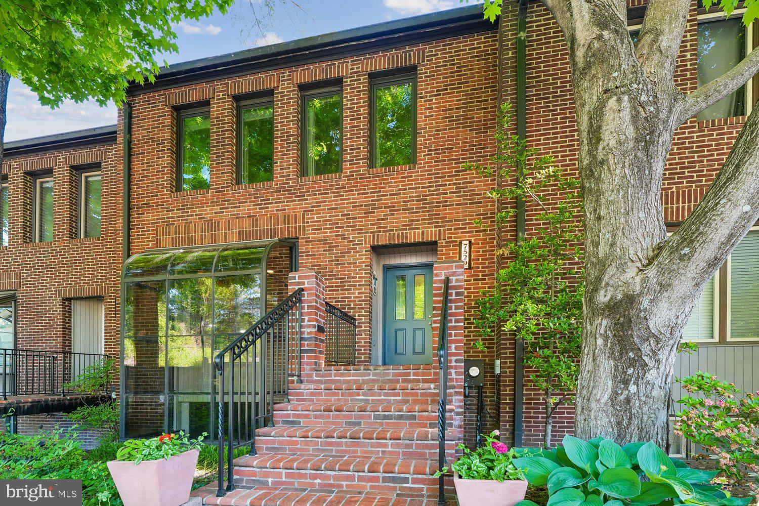 Wonderful contemporary townhome, thoroughly updated with custom features throughout. Delightful kitchen with custom built cabinets, high end appliances and expansive greenhouse window. Dining room overlooks two story living room featuring glass doors to deck and fireplace. Dramatic staircase flooded withsun light from oversize skylights plus exposed beams. Primary bedroom with walkin closet and ensuite remodeled full bathroom. Two additional bedrooms and full bathroom. Lower level features two tier recreation room with fireplace and glass door to patio; bonus room (not a true bedroom, no egress) plus full bathroom; laundry/utiltiy room. Countless custom features including rare eucalyptus wood flooring. Backing to golf course with scenic views and privacy. Delightful everywhere you turn. Don't miss! OPEN 5/31  1-3