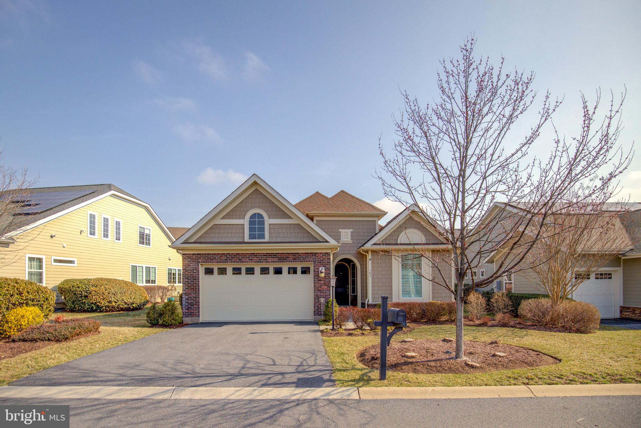 Don't miss this rarely available, former "Refresh" Model Home built by Shea Builders, in the sought after 55+ Active Adult Community of Lake Frederick, custom finished with so many upgrades!  Located on a private street with a 2-car garage on two levels, 4 spacious bedrooms and 3 full baths, and SOLAR PANELS INCLUDED with little or no cost to your electric bill each month!!  This home is designed for both comfort and luxury throughout with its sheer size, quality building materials, & open concept living.  Once inside you are welcomed with wide hallways, 10 FOOT CEILINGS, recessed lighting, lovely wide-plank hardwood flooring, and high-end window treatments.  The Gourmet Kitchen is a chef's dream with an over-sized center island with granite countertops, stainless steel appliances, and a farm sink.  The open living and dining spaces lead to an inviting custom paver patio with a built-in fire pit for enjoying with family and friends.  The main level also features a Primary Bedroom and a luxurious bathroom suite with elegant tiles, fixtures, and a large walk-in closet with custom built-in shelving and drawers.   A secondary bedroom is also on the main level and is located on the opposite end of the home for privacy, complete with its own full bath and elegant bathroom tiles & fixtures.  Off of the garage there is a large Laundry/Mud Room with a top-of-the-line Speed Queen washer & dryer, an oversized farm sink, granite countertops, upper and lower maple cabinets and drawers with a spacious workspace, and plenty of brass hooks to hang your coats and hats as you come in from a busy day.

The expansive lower level with LVT flooring is an entertainer's paradise complete with a spacious recreation area, a stunning Gas Fireplace surrounded by two reclaimed-wood shiplap walls, recessed lighting, and a large L-shaped Wet Bar with granite counters and bar stools, upper and lower maple cabinetry with a refrigerator and wine cooler.  This level also offers two bedrooms with a full bath and a Custom Steam Shower and includes ample space with a finished Office/Storage area.   The lower level provides wide walk-up stairs with access to your patio area for your convenience and entertaining.

Last, but not least, don't miss the fantastic amenities that are available with this home which includes the expansive Shenandoah Lodge with its Farm-to-Table Restaurant overlooking Lake Frederick, classrooms, fitness center, indoor and outdoor pools, pickleball courts, tennis courts and so much more.  This is what resort living is all about...just move-in and enjoy!!