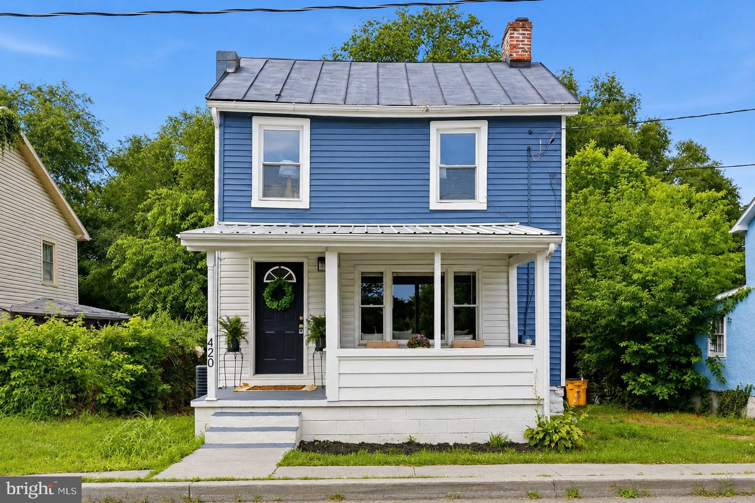 Welcome to 420 E. North Street: perfect for those who seek a move-in ready home with timeless character throughout. Fall in love with this remodeled, colonial-style home located within the heart of Charles Town within walking distance to shops and restaurants. Located right off the foyer is a spacious living room which offers a large picture window permitting plenty of natural light.  You will appreciate the BRAND NEW vinyl plank flooring throughout the main level.  The kitchen offers new LVP flooring, new electric stove, new built-in microwave, and newer Stainless Steel refrigerator. There is a powder room located on main level and upper level offers an upscale full  bathroom.  Upper level has BRAND NEW CARPET throughout. New lighting has been installed and home has been professionally painted. Heat pump is new as of 2024.  Private, tree-lined backyard with mature landscaping and expansive green space, offering a peaceful setting for entertaining, recreation, or simply enjoying the outdoors. Don't wait: schedule your tour today. OPEN HOUSE: Sunday, July 5th 12PM-1:30PM.