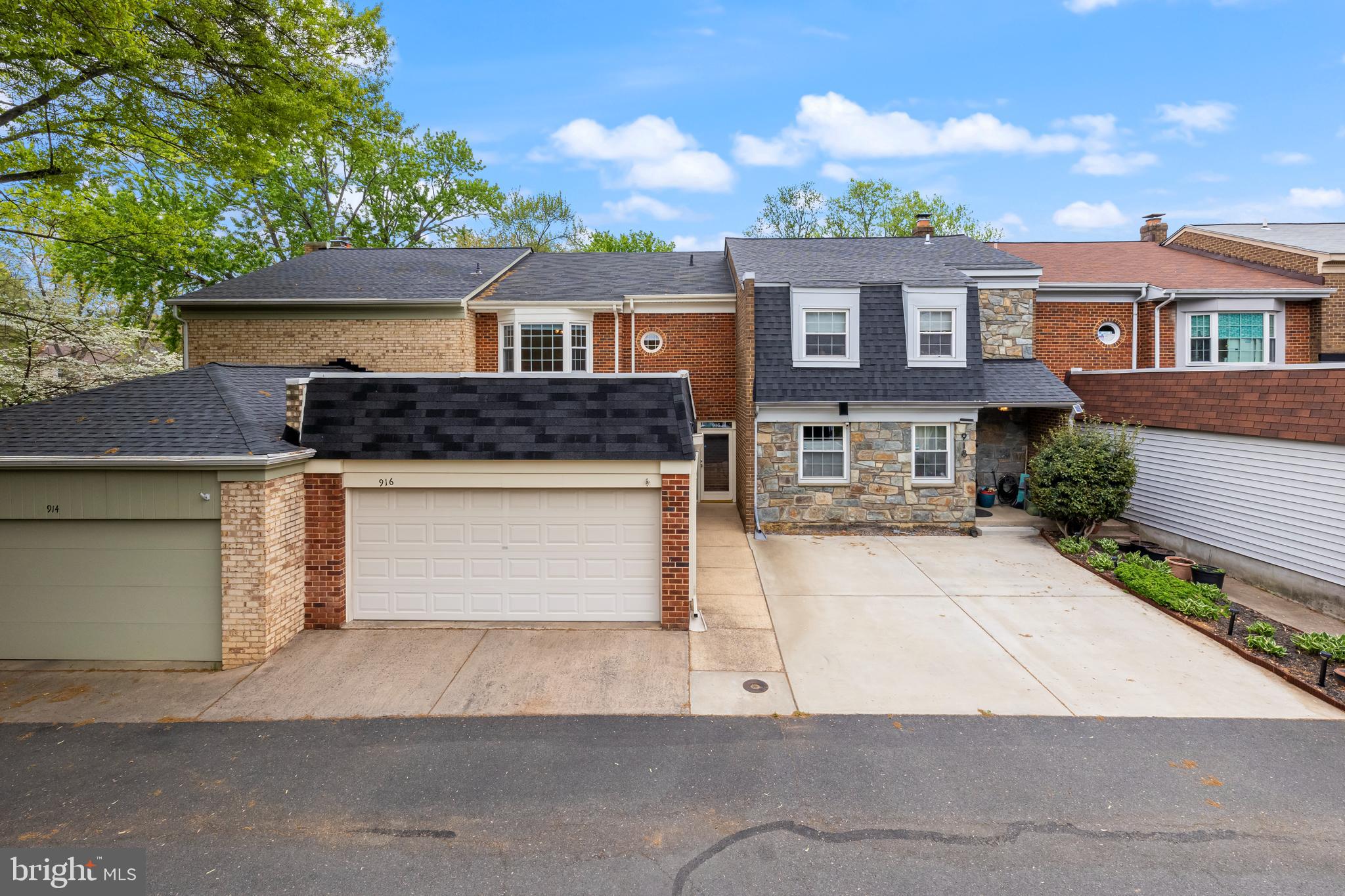 PRIME LOCATION within walking distance to Vienna Metro!  Welcome to the Townes of Moorefield! This beautiful all-brick 3-level, 3 bedroom 3.5 bath townhome with nearly 2,500 sq ft of finished living space has been well cared for.  The oversized two car garage will protect your cars from hot summers as well as snow in the cold winters, while also providing extra storage! The front entry welcomes you to the main level with gleaming hardwood floors. Central to this floorplan is the kitchen with Corian countertops, kitchen island, clean white cabinets, tiled backsplash, crown molding and custom built-ins and opens to a spacious dining room. The living room boasts a cozy fireplace, custom built-in shelving, and lighted ceiling fan. A half bath and a walk-in closet/storage round out the main level. Upstairs you’ll find hardwood flooring in flawless condition. The primary bedroom is both welcoming and spacious with a large walk-in closet, attached primary bath, bay windows that flood the room with natural light, and a lighted ceiling fan. Two additional bedrooms with ceiling fans, walk-in closet and a hallway bath are located on the top level. The basement has gorgeous luxury vinyl plank flooring and a huge recreation room with a fireplace. Adjacent to the rec room, you’ll find a bonus room that can be used as a home office or a not-to-code 4th bedroom along with a full bathroom and a storage closet. A laundry room with additional storage space is also located in the basement. The backyard is huge and boasts a privacy fence, concrete patio and zero maintenance pebbles; the perfect spot for a fire pit! What a great outdoor space to entertain family and friends! Recent updates include: New HVAC June 2022, Soundproofed living room walls 2023 ($10k upgrade), newly painted 2023. Upgraded fixtures and lights along with new electrical panels and brand new circuits 2023. New Refrigerator 2024. LVP added to basement laundry room.  Updated primary bath vanity (2021), updated secondary bath on the upstairs level (2021). This community has wonderful amenities including swimming pool, tennis courts, playground, and walking paths leading to Nottoway Park. Location couldn’t be better. The lot backs to thick trees. Very quiet! Only a half mile 10-minute walk to the Vienna Metro! Tons of restaurants, groceries, retail shopping, and entertainment options nearby. Just 9 minutes from Tyson’s Corner. Easy access to Dulles Toll Road, Rt, 28, Rt 50, I-66, Rt. 236, and I-495. Zoned for Madison High School, Thoreau Middle School & Marshall Road Elementary.