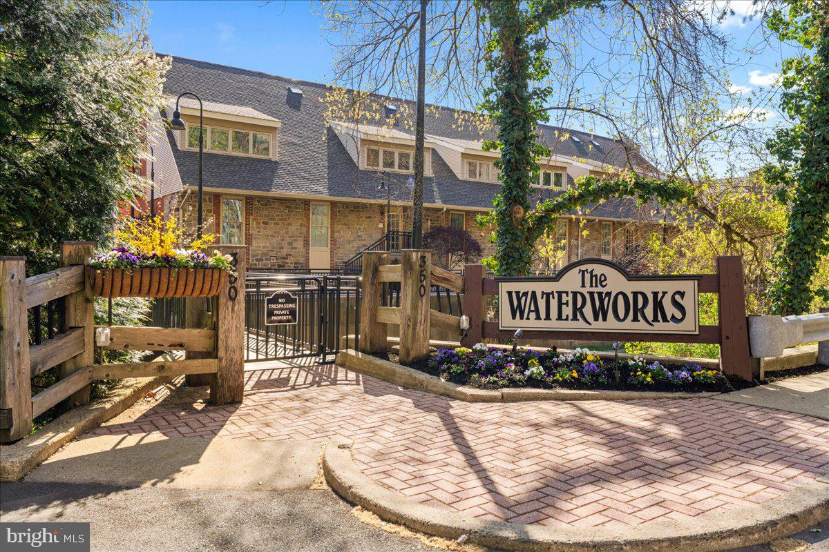 Where History Meets the Horizon. Experience the pinnacle of waterfront living in this masterfully restored historic mill. The Waterworks in downtown New Hope PA is a luxury condominium complex nestled between the tranquil Delaware Canal and the majestic Delaware River. This multi-level 2-bedroom, 2-bathroom residence offers a rare opportunity to own a piece of New Hope’s architectural heritage while enjoying every modern luxury. The assurance of a secure lobby entrance provides peace of mind for you and your guests. From the foyer, step up into an expansive, sun-drenched open floor plan where every detail has been curated for the discerning eye. A high-end renovation of the gourmet kitchen features premium finishes and a layout designed for entertaining. Authentic wood-burning fireplaces in both the living room and the master suite provide a warm, sophisticated ambiance for cool river evenings. The upper level provides a sanctuary and welcome retreat to a private riverfront balcony directly off the primary suite—the perfect vantage point for morning coffee or sunset views. Large windows throughout the home flood the space with natural light, highlighting the seamless transition between indoor and outdoor living. At The Waterworks, your lifestyle isn't confined to your walls. With the Delaware Canal State Park towpath at your doorstep, spend your days hiking, biking, or birdwatching. Launch your canoe or kayak and explore the scenic waterways of Bucks County. Leave the cars in your secure garage with two dedicated spaces - a rare and valuable commodity - as you are mere steps from fine dining, world-class art galleries, and antique shops of downtown New Hope PA and Lambertville, NJ. And enjoy premier entertainment at the nearby historic Bucks County Playhouse. Perfectly suited as a prestigious primary residence or the ultimate weekend sanctuary for those seeking a lock-and-leave lifestyle. Come for a weekend, stay for a lifetime!