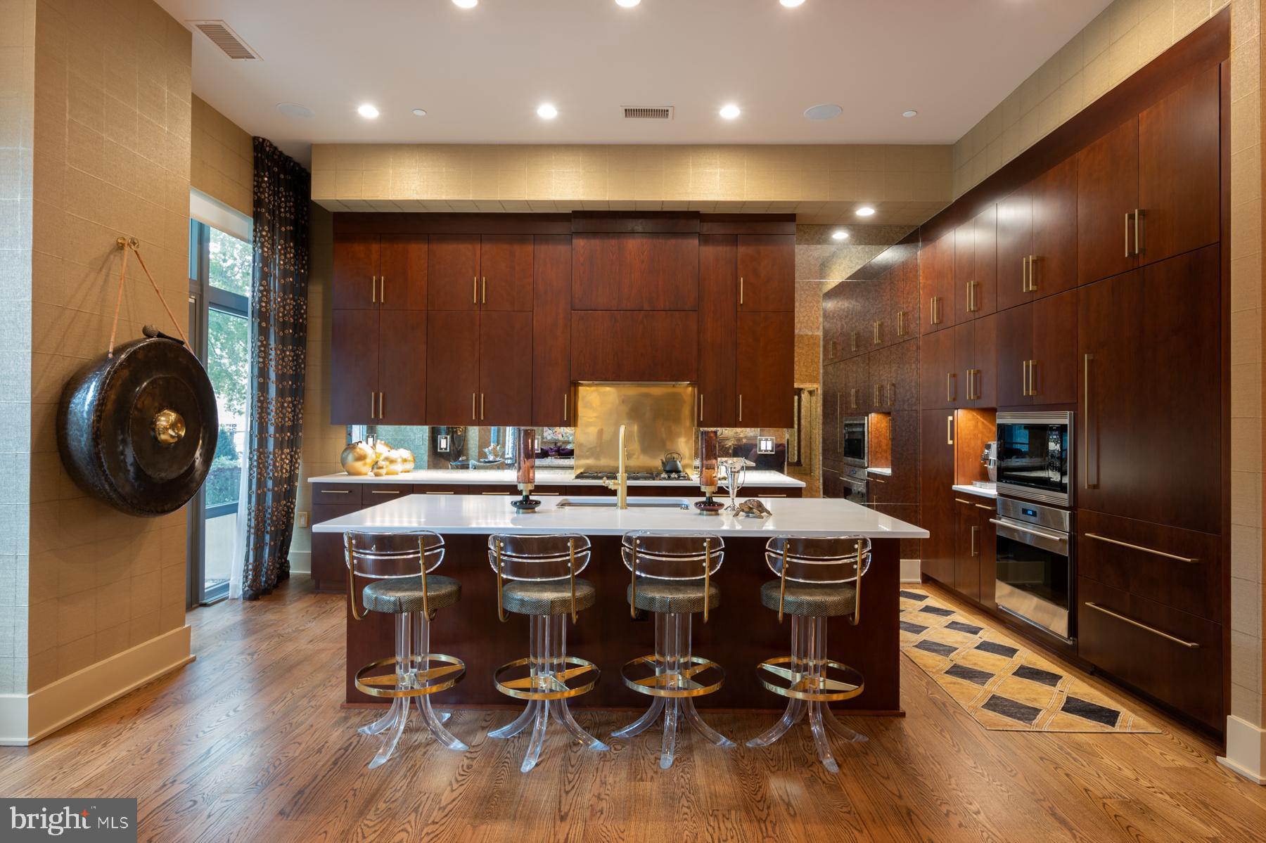 Soaring 11 ft ceilings, sprawling private terrace, custom finishes, and no detail has been overlooked in this residence. The gourmet kitchen features appliances from Wolf and Sub-Zero; custom cabinets, copper backsplash, and a large island. The primary suite features spacious closets and an en suite bathroom with zero entry shower, marble tile, and fixtures by Waterworks. The unit includes automated shades and Starr Savant system equipment for automation of home lighting, audio, and includes recessed speakers in the ceiling. Three assigned, underground, parking spaces are included as well as a private storage unit. The Oronoco is a full-service building offering Concierge, 24-hour security, meeting room, children's room, fitness center, yoga studio, outdoor heated pool, and dog wash station. The community is located on the banks of the Potomac River, just a few blocks from the shops and restaurants on King Street. Enjoy Oronoco Bay Park and the walking/bike trail along the river. This is one level living at its finest!