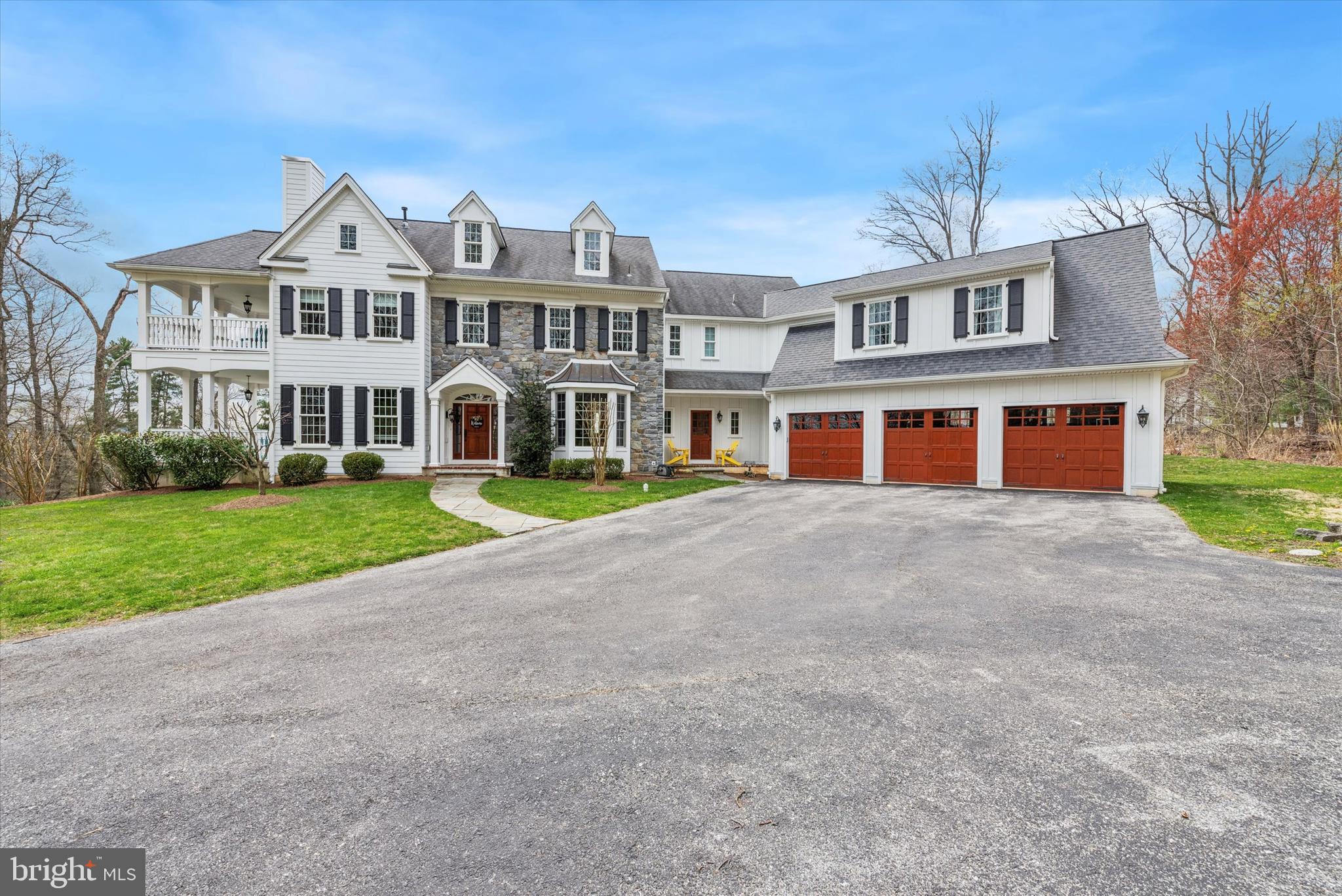 Immerse yourself in modern luxury with this expansive 5-bedroom home on a sprawling 2.33-acre lot. Gleaming hardwood floors with an inlaid design lead you into a grand foyer. To one side, a formal living room boasts a two-way gas fireplace that extends the warmth to a covered  porch. On the other side, a sun-drenched dining room awaits, complete with wainscotting and crown molding.

The chef's kitchen is a dream for entertaining, featuring high-end appliances, granite countertops, a farmhouse sink with a view, and an island with ample seating. Unwind in the family room, complete with built-in shelving and a second fireplace for cozy nights in.

For ultimate practicality, the first floor features a mudroom to keep clutter at bay, a private office for focused productivity, and two conveniently located powder rooms.

Upstairs, discover a haven in the primary bedroom, complete with a sitting area, private balcony access, dual walk-in closets, and a spa-like bathroom featuring a soaking tub, separate vanities, and a luxurious shower. Four additional bedrooms offer flexibility, with two boasting en-suite baths and two sharing a Jack and Jill bathroom, for a total of 4 bathrooms. A well-equipped laundry room and access to the unfinished attic space round out the second floor.

The full, walk-out basement with high ceilings offers endless possibilities for an in-law suite, recreational room, or additional living space. Dual HVAC systems and pre-wired Cat-5 network cabling ensure ultimate comfort and seamless connectivity. This expansive dream home offers the perfect blend of spacious living and serene privacy.