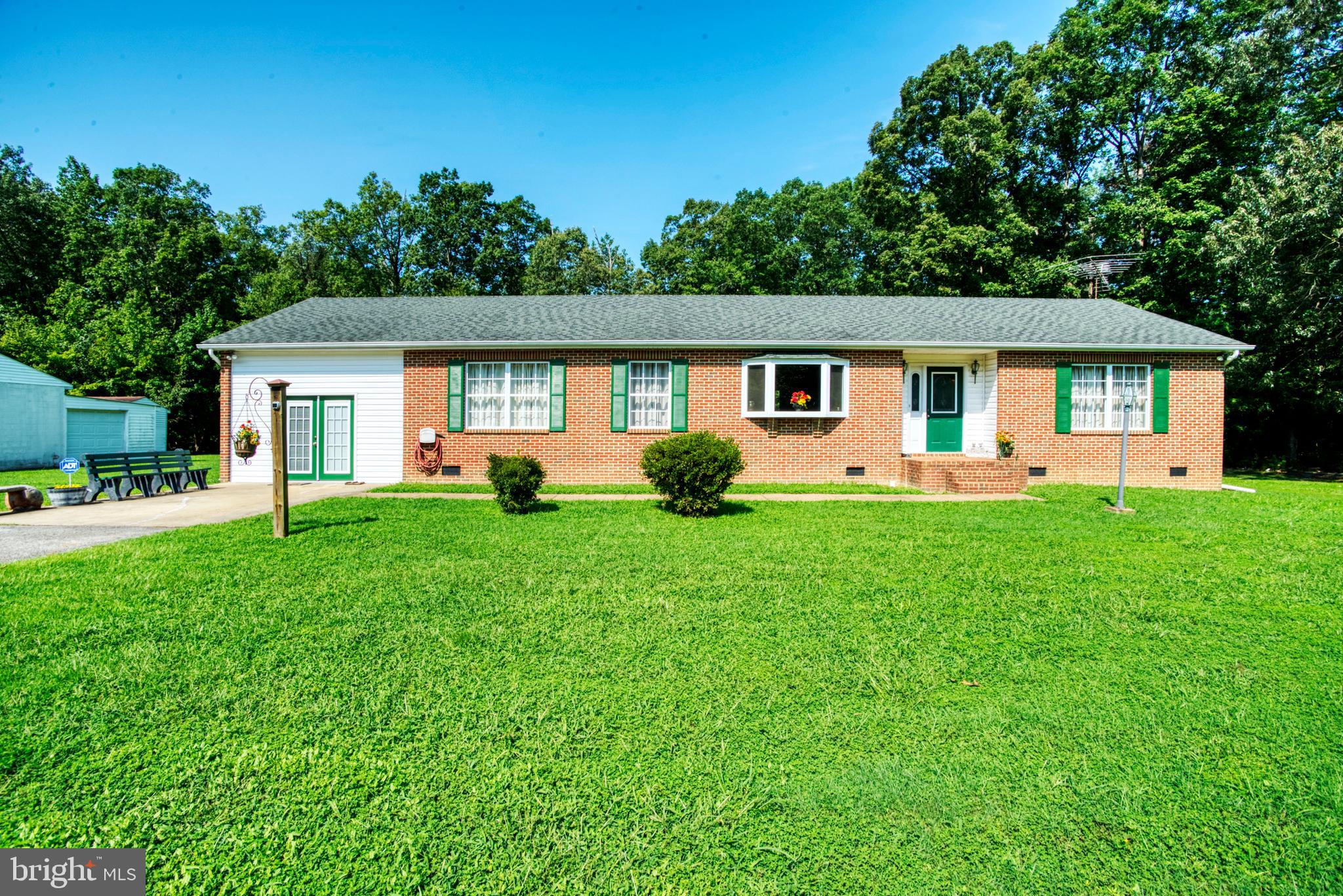You'll love this 2000+ sq ft ranch-style home with views of trees that outline your expansive yard.  Take some time to sit back and relax on your private deck, surrounded by 4 acres.  This home offers a spacious open layout of the Kitchen, dining, and family rooms, all easily accessible from one another but also designed for cozy dinners and gatherings.  You can also enjoy relaxing while gazing out your large sun-filled picturesque front window.  You'll be surprised by the spacious bed and bathrooms, as well as the closet spaces. Mechanics and hobby/crafters will enjoy the detached  3 bay garage with electricity, from oil changes to the crafty side in you as well as  2 outbuildings for storage.   Conveniently located next to a local park and paved walking trails, and just 15 minutes to Downtown LaPlata for shopping and an evening for dining out.  Less than 5 miles from the Indian Head Highway corridor, and minutes from the local schools.  Masks are required and limited to 3 people in the home at one time.