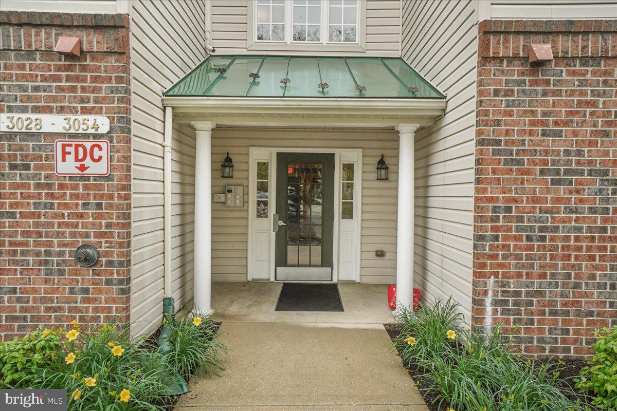 Enjoy the comfort and ease of one-level living in the Buckingham community! Beautiful third-floor condo embellished with soaring vaulted ceilings, open concept floor plan, neutral color palette. and light-filled interiors! Secure building with an ELEVATOR!; Living | dining rooms graced with custom built-in shelving and easy access to the balcony; Eat-in kitchen with ample cabinetry, sleek appliances, and pantry; Primary bedroom highlighted with en-suite full bath and sizable walk-in closet; Additional bedroom, full bath, and laundry room complete this home.  The exterior features landscaped grounds, secure main entrance, balcony, secure storage, sidewalks, streetlights, community center, pool, tennis courts, walking paths, and more! A MUST-SEE!