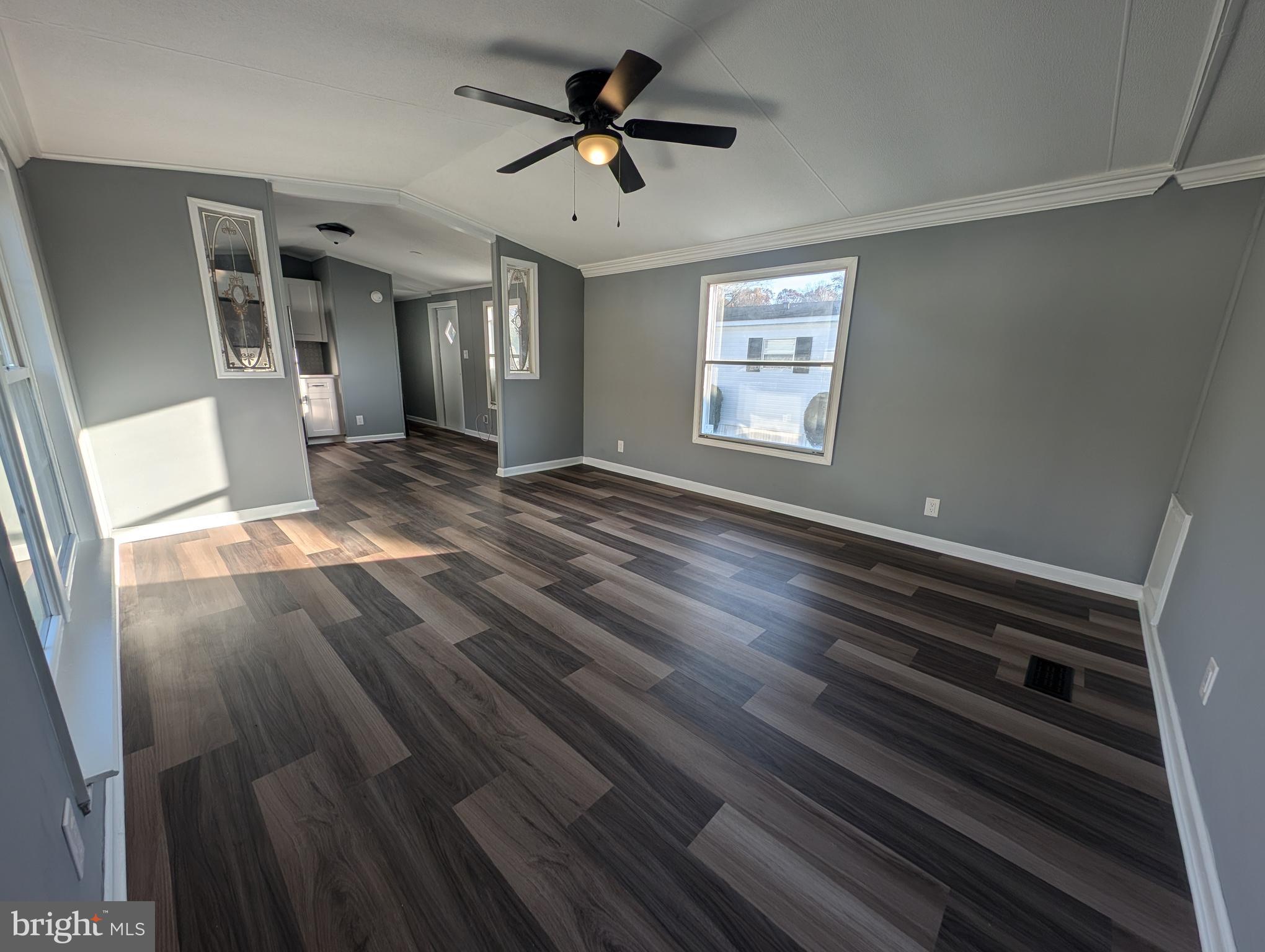 Stunning renovation with beautiful floors and personalized touches that make this mobile home unique. It features a new roof, floors, bathrooms and plumbing, ensuring the home has solid foundations! Checkout the ceramic tile in each bathroom! The house is situated on a spacious corner lot.