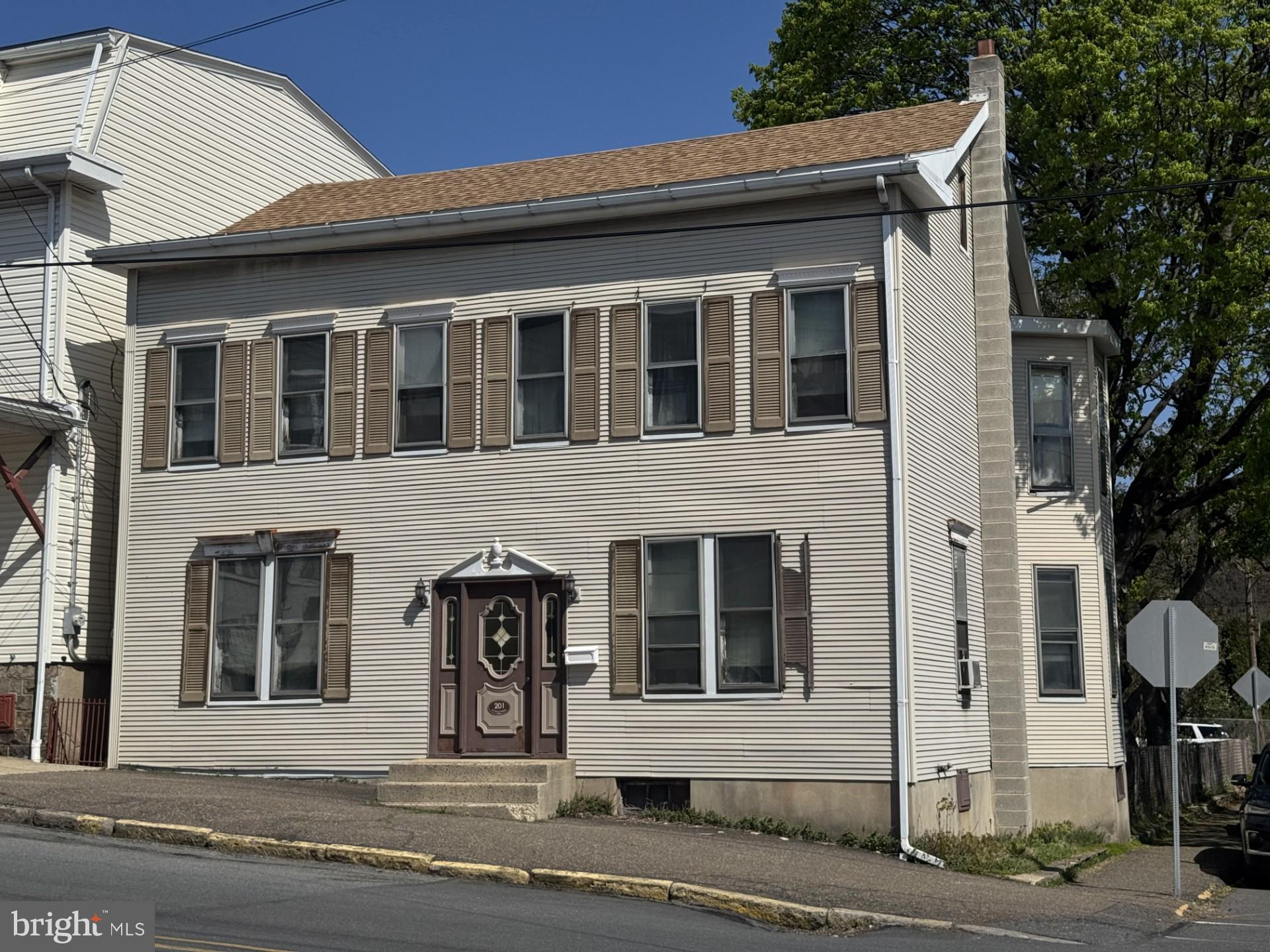 Large Victorian home with fenced in yard off street parking.  6 bedrooms 2 and 1/2 bath. Plenty of space. Natural woodwork. Hard wood floors under carpet. Oil heat. Needs some updating and some TLC. Newer roof. Own this great home with an entry level price.