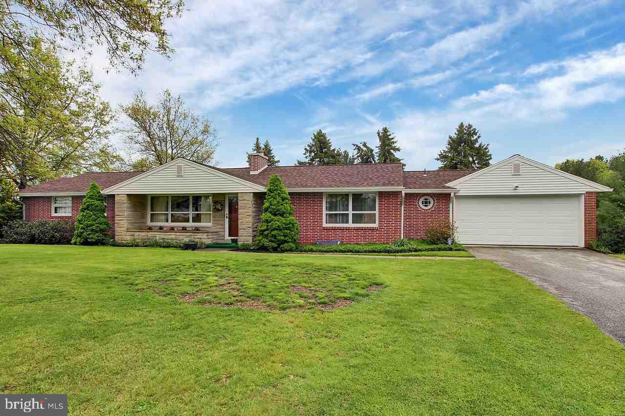 Well-cared-for home on 9+ acres that includes a barn & stream.  Many  improvements such as new septic, newer roof, electric, GAR door & windows, etc.  1st flr has 3BR, 1.5BA, den, LAU, KIT, LR w/ FP & DR w/ buffet & corner cabinet.  BSMT has large FR w/ FP, KIT, storage & workshop.  Lots of potential in this beautiful piece of property.  Ideal country location, but just minutes from conveniences.