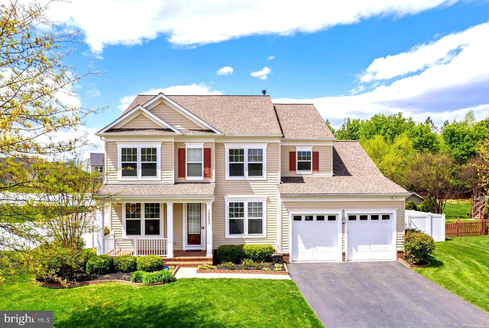 Welcome to 16452 Chattanooga Lane in the highly-regarded Powells Landing community. This elegant colonial-style single family residence spans over 4500 sqft on three finished levels.  Built in 2010 and immaculately maintained there is space here for any/all making it perfect for those seeking space, quiet, comfort, and upscale living. This house is light, bright, tastefully updated, and ready for a new family to call it home! The main level features a formal living room (easily used as study), and formal dining room to the right and left of the main entrance when stepping inside. The upgraded wood floors shine throughout the entrance and into the primary family space which is completed with windows (there are windows everywhere!) and a gas fireplace. Opposite the massive family room is one of the best-planned-kitchen spaces you will ever see! There is an eat-in space and just behind that is the kitchen island with breakfast bar. Beyond the island is the cooktop and microwave while to the left is more cabinets with large sink and views of the backyard and to the right is the fridge even more cabinets and a double oven! There is a service pantry on the left side with a walk-in pantry too, and on the right is a mudroom and access to the garage (don't miss the TALL garage doors). This is one of the most thoughtful kitchen layouts with space for everything, everyone, and counter and cabinet space galore! The upper level, the residence, includes three large guest rooms with LARGE closets, a full ball bathroom, and top-floor full size laundry machines in a laundry room! The primary bedroom is a jaw-dropper with a clever his/hers walk-in closet that provides both space for clothing and privacy. The primary bathroom has a double vanity setup including space for make-up /bench or laundry hamper and separate standing shower and soaking tub too! The lower level has a secondary family space, home gym/theater/study, mechanical room, full bathroom, and a bedroom/flex room  with yet another massive walk-in closet. The backyard is fully fenced-in with a privacy fence, matching storage shed, and gorgeous end to end paver patio! Outside there is a built-in awning that can be opened to keep things cool and fireplace to heat things up too! Professionally landscaped, just mulched, and in-ground sprinklers keep things looking tidy on the outside. Just bring your rocking chairs for the front porch and enjoy! Newer roof, HVAC, and water heater... this house has been meticulously maintained and truly needs nothing. Come and see this one in person!