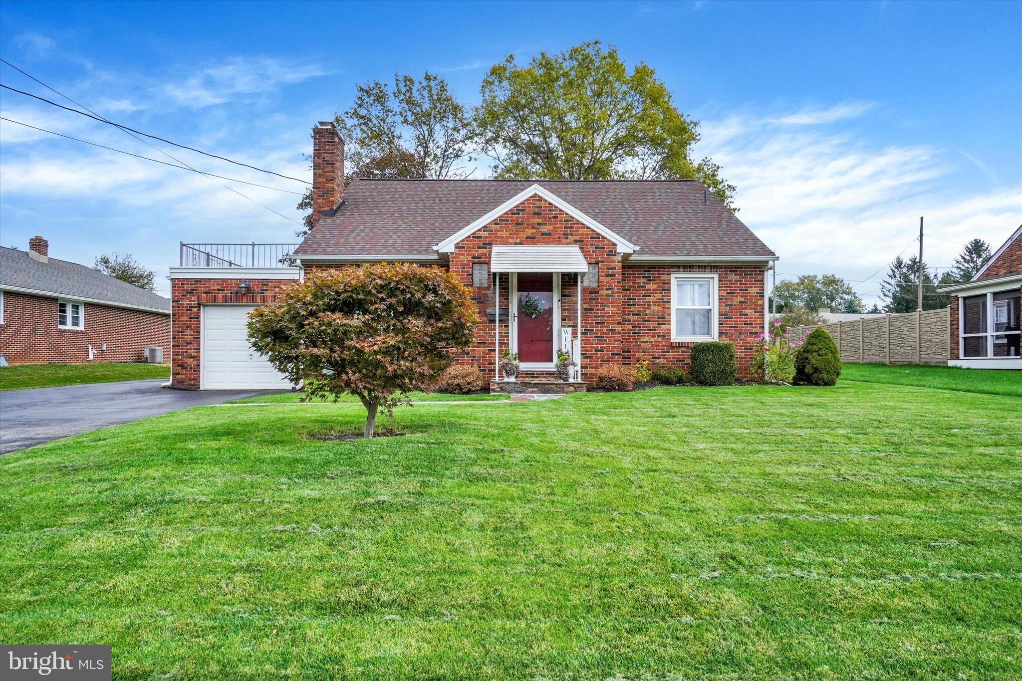 This delightful, move-in ready Cape Cod will have you at, "Hello!" Flagstone leads to the front door & entry foyer revealing a beautifully updated interior with new LVP flooring throughout. The inviting living room is warmed by a brick wood burning fireplace with gas log insert & illuminated with recessed lighting. Open dining room includes crown & chair moldings, plus a convenient breakfast bar at the threshold of the tastefully updated Kitchen, boasting granite counters, tile floors & backsplash, SS appliances & easy access to the stamped patio. Two main level bedrooms & a full bath are supplemented by a large second floor primary suite with full bath & private rooftop balcony over the garage. Additional gathering space is found in the finished basement, which offers a huge family room, dry bar, built-ins & half bath. All the baths have been updated with tasteful new fixtures & ceramic tile. Other enhancements include updated windows, new roof & new water heater.  Outside is neat as a pin, with a fantastic level yard, private patio with built-in storage, an additional storage outbuilding, 1-car garage & paved driveway with large parking pad & turnaround. Wonderful location seconds to Shrewsbury square shops & dining, & 1 mile to 1-83. This home needs nothing but your furniture! Unpack & enjoy!