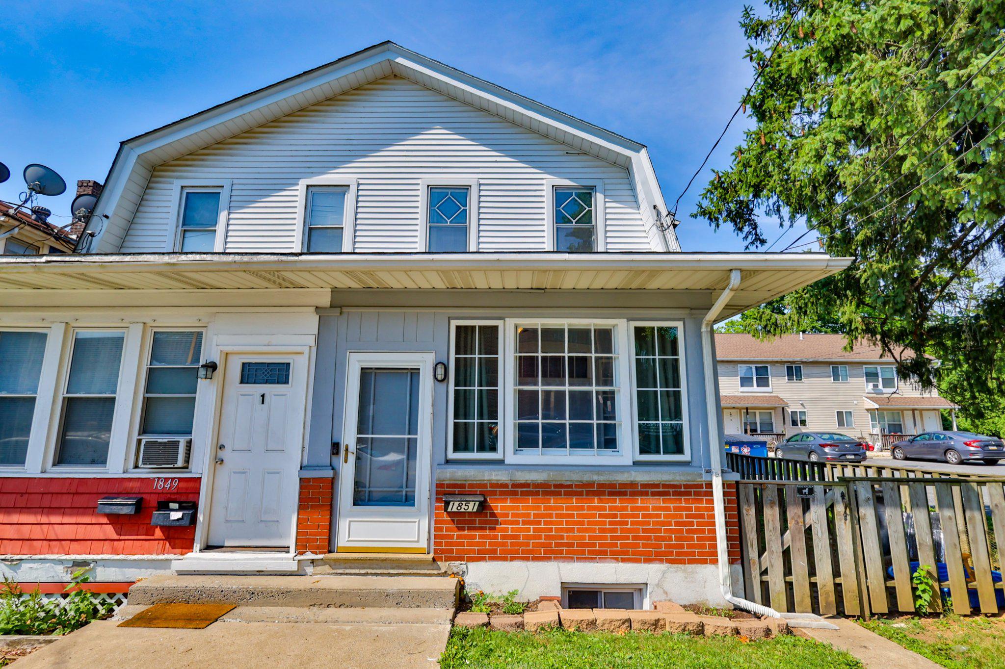 Welcome home to this charming, move-in-ready semi-detached twin in Bethlehem. Steeped in local character, this 3-bedroom, 1.5-bath home greets you with a bright, heated enclosed porch highlighted by custom built-in bookshelves—the perfect spot for a cozy reading nook. Inside, stunning hardwood floors run throughout the spacious, light-filled living and dining areas. The main level also features an incredibly convenient half bath, thoughtfully converted from the original pantry space. The modernized kitchen boasts premium quartz countertops, a classic tile backsplash, and stainless steel appliances. Upstairs, tucked behind original solid wood doors, you will find three bedrooms featuring character-rich softwood and durable vinyl plank flooring, a dedicated cedar closet, and ceiling fans installed throughout for year-round comfort. The full bathroom serves as a relaxing retreat, showcasing a timeless clawfoot tub and shower. The walkout basement adds immense utility to the property, housing a laundry area, a dedicated workshop space, and abundant storage. Walk right out into your private, fully fenced-in backyard, which is perfectly suited for pets, gardening, or outdoor entertaining. With central air, a new HVAC system in 2024, and an active radon mitigation system already installed, all the major updates are done for you. This turnkey property delivers completely stress-free living in an unbeatable location near local shops, vibrant dining, and community events. Showings begin Friday July 3. Open House Sunday July 5th 1-3pm