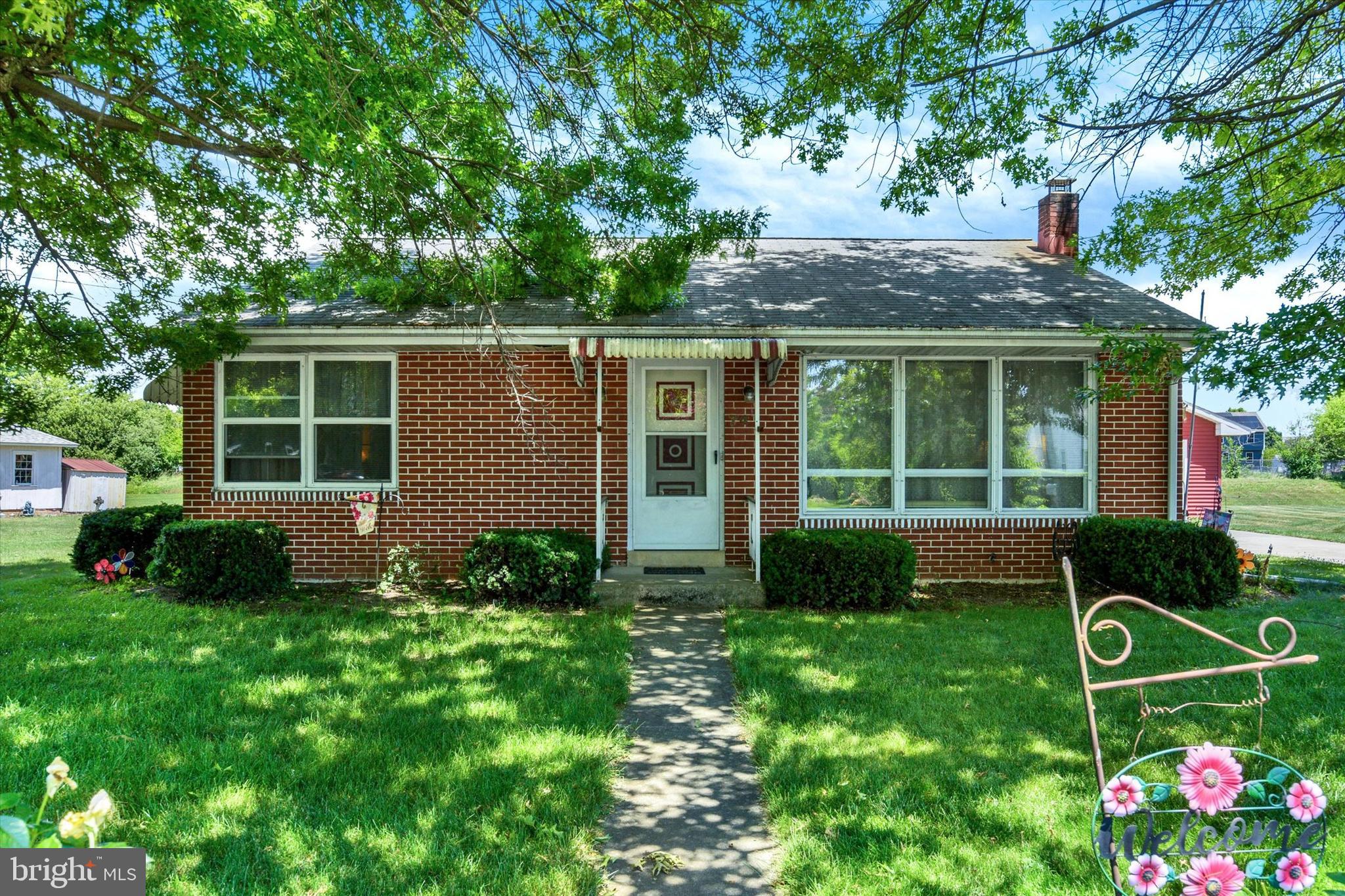 Welcome to 74 Palmyra Road, a well-maintained all-brick ranch home offering comfortable one-floor living. This two-bedroom home features hard-wood floors throughout much of the main level and has been exceptionally cared for over the years. The home is heated with gas radiant heat, and the finished lower level includes a family room, laundry area, additional storage space, and a supplemental gas heater for added comfort. Central air conditioning provides year-round convenience. One of the property's standout features is the garage space. In addition to a detached one-car garage, there is a separate detached two-car garage, providing ample room for vehicles, storage, hobbies, or a workshop. Conveniently located within walking distance of Campbelltown, you'll enjoy easy access to local restaurants, shops, and a popular ice cream shop. This move-in-ready home offers a combination of quality construction, practical features, and a convenient location. Being sold AS IS.