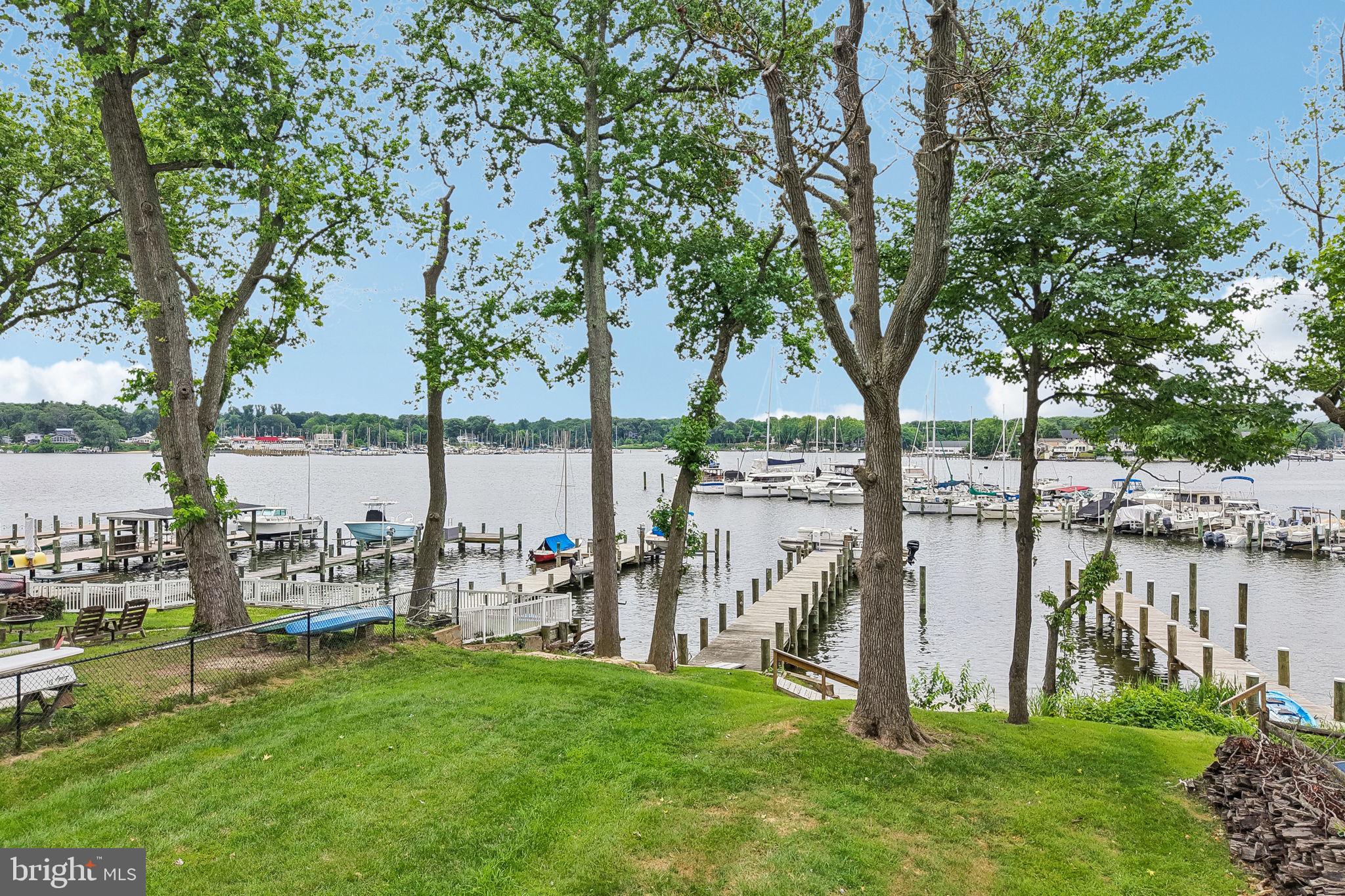 WATERFRONT LIVING AT ITS FINEST! Nestled along  Rock Creek & directly across the creek from the Maryland Yacht Club & the famous Mike's North Restaurant, this beautifully UPDATED 4-bedroom, 3-bath home offers the perfect blend of comfort, convenience, and BOATING lifestyle. With over 2,400 square feet of living space and a FULLY FINISHED WALK OUT BASEMENT, there's plenty of room for family, guests, and entertaining.

The heart of the home features a stunning renovated kitchen with QUARTZ countertops, dual islands, INDUCTION  Cooktop,  DOUBLE OVENs, Under-cabinet lighting, Pantry, and WET BAR. Recent improvements throughout includeUPDATED FLOORING THRU-OUT, Fresh paint, NEW LIGHTING, Newer WINDOWs, BRAND NEW CARPETING, and Beautifully RENOVATED BATHROOMS.

Step outside to enjoy incredible WATER VIEWS from the expansive 600-sqft deck complete with CABLE  RAILINGS, privacy screening, UPGRADED ELECTRIC & WATER service, and plenty of space for gatherings. Follow the path to your private waterfront retreat featuring a 115' PIER with ELECTRIC & WATER, SANDY BEACH AREA at low tide, fire pit, 10,000 lb BOAT LIFT, and Swim Platform. BOATERS  will love the easy access to the Chesapeake Bay & the convenience of fueling up just across the creek at the Maryland Yacht Club.

Additional features include a new sidewalk and extended driveway accommodating up to SIX VEHICLES,  waterproofed lower level, exterior paint, boat storage area, second laundry area in the primary suite, and numerous thoughtful UPGRADES THRU-OUT. This is more than a home—it's a WATERFRONT LIFESTYLE opportunity you won't want to miss.