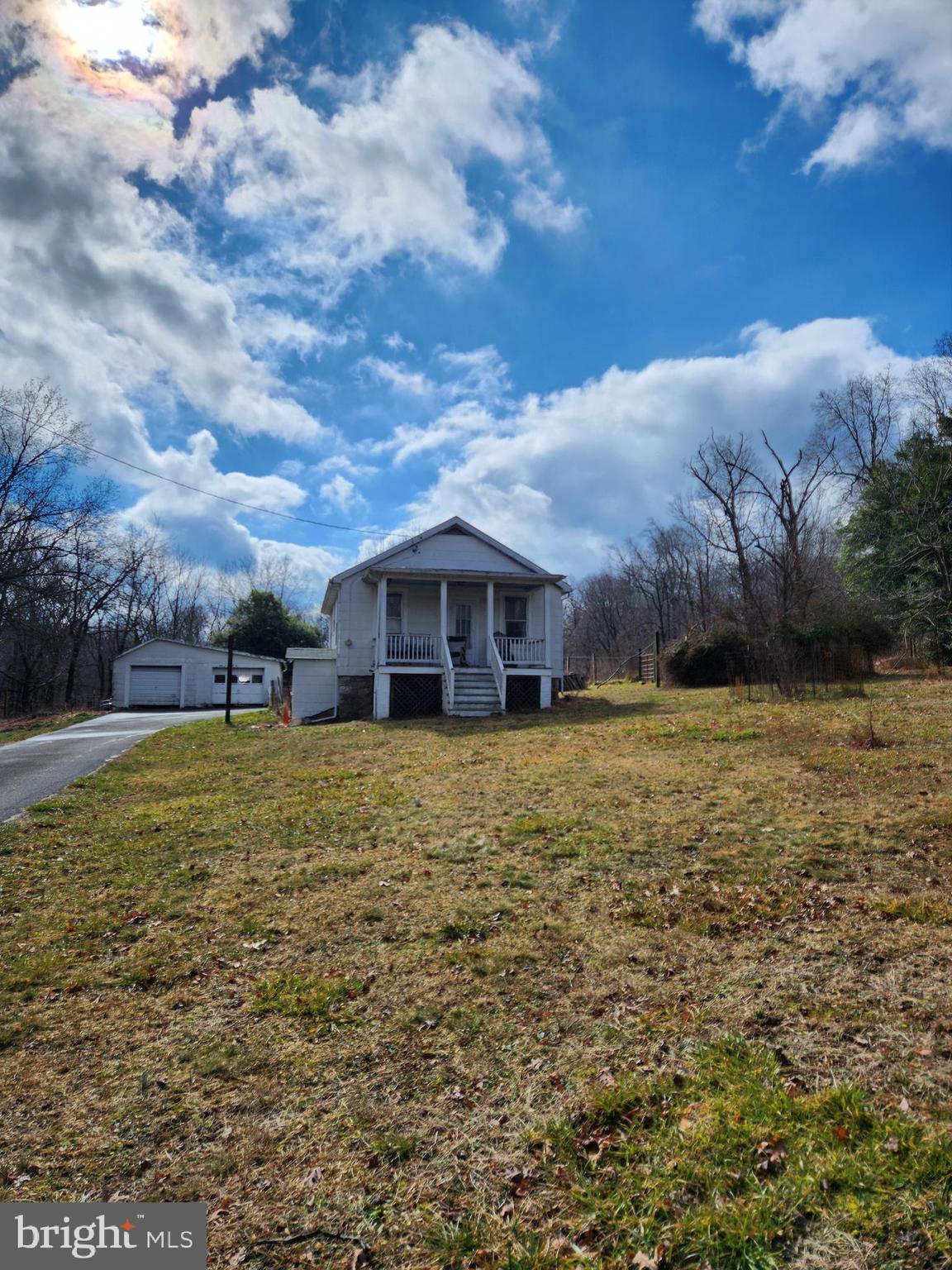 Six acres in Ellicott City! This wonderful property has a small 2 bed / 1 bath home as well as multiple outbuildings. Make an appointment to walk this beautiful property, the possibilities are endless!