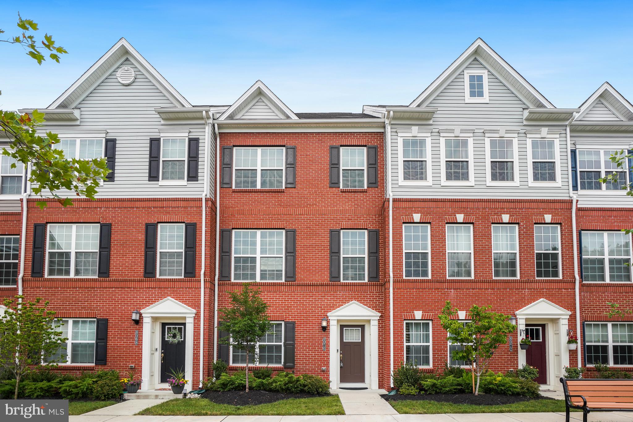 This exquisite Colonial-style townhouse, built in 2022, offers a harmonious blend of modern luxury and timeless elegance, perfect for those seeking a refined lifestyle. Spanning 2,000 square feet, this residence features four spacious bedrooms and three and a half beautifully appointed bathrooms, ensuring ample space for relaxation and comfort. Step inside to discover an inviting open floor plan that seamlessly connects the living, dining, and kitchen areas, creating an ideal setting for both entertaining and everyday living. The heart of the home is the gourmet kitchen, equipped with high-end stainless steel appliances, including a built-in microwave, gas range, and a convenient down-draft cooktop. The expansive island serves as a focal point for gatherings, while the upgraded countertops and ample pantry space elevate the culinary experience. Natural light floods the home, accentuating the rich floors and elegant crown moldings that adorn the main living areas. The cozy breakfast nook invites leisurely mornings, while the formal dining area sets the stage for memorable dinner parties. Each bedroom is a sanctuary of tranquility, with the primary suite boasting a luxurious en-suite bathroom featuring a soaking tub and a separate stall shower, perfect for unwinding after a long day. Additional highlights include a convenient entry-level bedroom, ideal for guests or as a private office, and a dedicated laundry area located on the upper floor for added convenience. The home is equipped with modern security features, including exterior cameras and a monitored fire detection system, ensuring peace of mind. Outside, the property offers a low-maintenance lifestyle with a concrete driveway leading to a built-in two-car garage, providing both convenience and security. The compact lot size allows for easy upkeep, giving you more time to enjoy the finer things in life. This residence is not just a home; it's a lifestyle choice that embodies comfort, elegance, and modern convenience. Experience the perfect blend of luxury and practicality in this stunning townhouse, where every detail has been thoughtfully designed to create a warm and inviting atmosphere. Embrace the opportunity to make this exceptional property your own and enjoy the lifestyle you deserve.