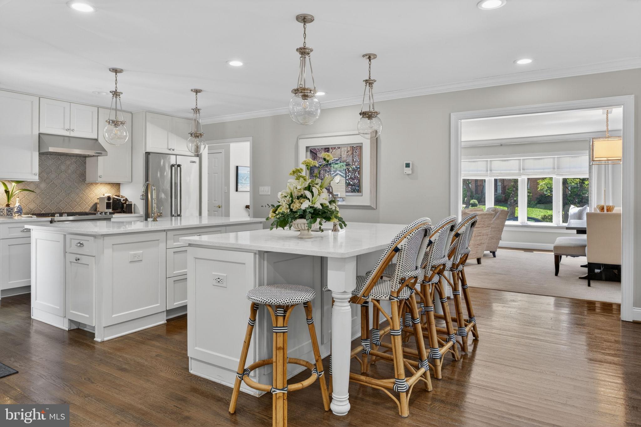 ** Open House on 6/28 is Cancelled — Property Under Contract ** Nestled on a quiet street in sought-after North Arlington, this beautifully reimagined 4-bedroom, 3-bath residence offers timeless design, thoughtful updates, and exceptional indoor-outdoor living.

At the heart of the home is a stunning renovated kitchen featuring crisp white cabinetry, dual granite islands, abundant prep space, and seamless connection to the spacious family room with a gas fireplace. Glass doors extend the living outdoors to an expansive Trex deck overlooking professionally landscaped grounds.

The main level also includes formal living and dining rooms, a light-filled primary suite with renovated bath, two additional bedrooms, and an updated hall bath.

The walkout lower level offers exceptional flexibility with a spacious recreation room centered around a second fireplace, direct access to the patio and backyard, a private guest bedroom with renovated full bath and oversized closet, plus a mudroom, dedicated laundry room, and oversized two-car garage with workshop and extensive storage.

A rare combination of refined updates, functional living spaces, and a coveted North Arlington location—this home offers comfort, versatility, and enduring appeal.