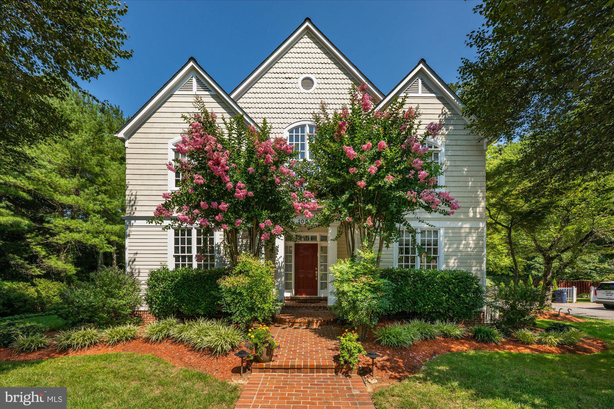 Please NOTE that this beautiful home is located on Democracy Lane, not Democracy Blvd.
Step into this gorgeous residence nestled within a private enclave of just 16 homes. Spanning an impressive 5,656 square feet on a .31-acre lot, this home offers an abundance of natural light and luxurious features throughout its expansive layout. As you enter through the grand two-story foyer, you'll be greeted by beautifully refinished hardwood floors that grace the main level. The main level boasts a library with exquisite custom built-ins, perfect for work or relaxation. Entertain guests in the formal dining room adorned with elegant crown molding. The chef’s kitchen is a culinary dream, featuring Wood Mode custom cabinetry, top-of-the-line appliances including paneled appliances and double ovens, a spacious kitchen island, granite countertops, ample table space, and built-ins. The kitchen seamlessly opens to the family room, where you'll find a cozy floor-to-ceiling fireplace. Both the kitchen and family room provide access to the deck, which features a convenient gas hookup, making it ideal for outdoor cooking and entertaining. Ascend the wide staircase to the upper level, where the spacious primary suite awaits. This elegant retreat features vaulted ceilings, two large walk-in closets, and a gas fireplace. The luxurious primary bath offers double vanity sinks, soaking tub, separate walk-in shower, vaulted ceiling, and skylights, creating a spa-like atmosphere. The upper level also hosts three additional bedrooms, each with exceptional closets, including one ensuite, and a hall bath, perfect for family and guests. The lower level offers a recreation room complete with a fireplace, providing a great space for leisure and entertainment. Additionally, you'll find the fifth bedroom, a full bath, large laundry room, and abundant storage rooms. Additional highlights of this home include custom window treatments, a wired audio system, a two-car garage, professional landscaping, and an outdoor sprinkler system. Ideally situated, this home provides convenient access to all three blue ribbon schools, Cabin John Village, Cabin John Park, Potomac Village, and major commuter routes. This residence is truly a masterpiece of design and functionality, offering a luxurious lifestyle in a serene and private setting.