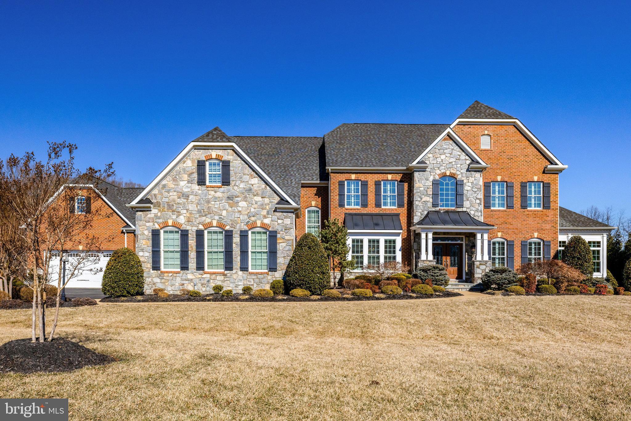 Welcome to your dream home, a stunning 5-bedroom, 5-full and 3-half bath residence nestled in a serene suburban setting. Built in 2013, this detached property boasts an impressive 9,566 sq. ft. of finished space, showcasing a perfect blend of modern elegance and comfort. Step inside to discover a meticulously designed interior featuring hardwood and plush carpet flooring, complemented by crown moldings and recessed lighting throughout. The gourmet kitchen is a chef's delight, equipped with stainless steel appliances, a six-burner stove, and an expansive island, making it ideal for entertaining. Enjoy cozy evenings in the family room off the kitchen or host formal dinners in the separate dining area. The primary suite offers a luxurious retreat with a soaking tub and walk-in shower, while additional bedrooms provide ample space for guests or a home office. Outside, the property is equally impressive, set on a sprawling 1.92-acre lot that backs to lush trees, providing a tranquil view and privacy. The extensive hardscape and landscaping enhance the outdoor living experience, perfect for gatherings or quiet relaxation. With an two attached oversized garages accommodating up to five vehicles and additional driveway space, convenience is at your fingertips. Located in a desirable suburban area, this home offers easy access to local amenities while maintaining a peaceful atmosphere. Don’t miss the opportunity to own this exceptional property that combines luxury, functionality, and a picturesque setting. Schedule your private tour today!