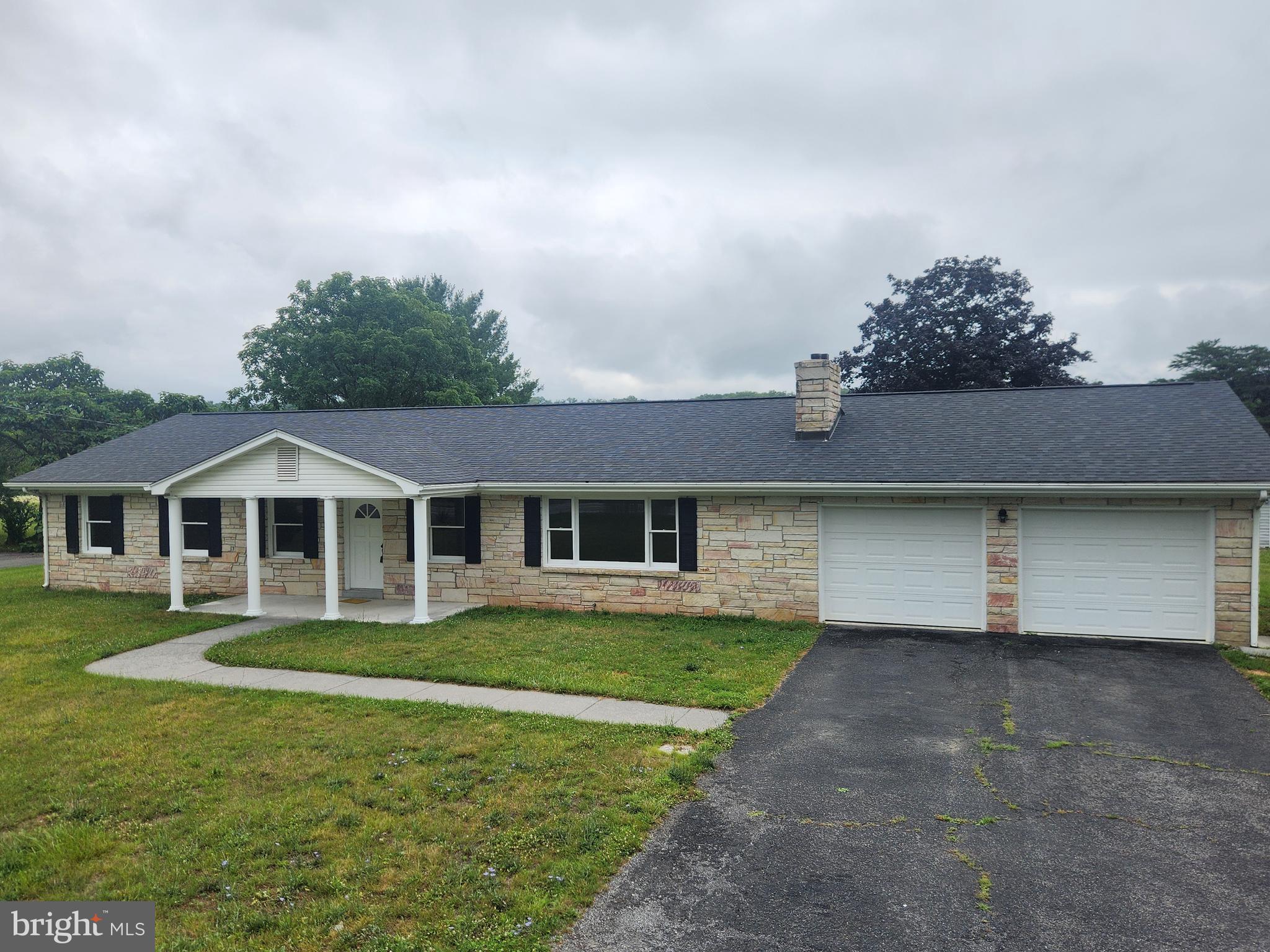 Beautifully renovated and move-in ready, this exceptional 3-bedroom, 2-bath ranch home sits on a picturesque 1-acre lot in the desirable southern part of the county, offering an ideal commuter location with easy access to Winchester, Virginia.

Featuring approximately 1,920 square feet of main-level living space plus an additional 900 square feet of finished basement, this home provides plenty of room for everyday living, entertaining, and working from home. The main level showcases beautifully refinished hardwood floors, fresh paint throughout, updated lighting fixtures, and generously sized bedrooms, including a spacious primary suite with a private en-suite bath.

The kitchen is both stylish and functional with new appliances, tile countertops, and a tile floor. The finished lower level offers endless flexibility for a family room, recreation area, home office, or fitness space and is conveniently accessible by both the interior staircase and a separate staircase from the oversized attached two-car garage. An additional 1,000 square feet of unfinished basement provides abundant storage or the opportunity for future expansion.

Outside, you'll find a fully fenced backyard, perfect for pets, children, and outdoor entertaining. Car enthusiasts, hobbyists, and anyone needing extra workspace will appreciate the oversized attached two-car garage, along with a detached two-car garage featuring a large workshop. Two separate driveways provide ample parking for multiple vehicles, trailers, RVs, or recreational equipment.

Additional improvements include a new electrical panel, fresh interior paint, updated lighting throughout, and numerous renovations that make this home truly move-in ready.

Offering the perfect combination of updated finishes, generous living space, outstanding garage and workshop options, and a highly convenient location, this is a rare opportunity to own a beautifully updated home with room to grow. 

Agent is Seller