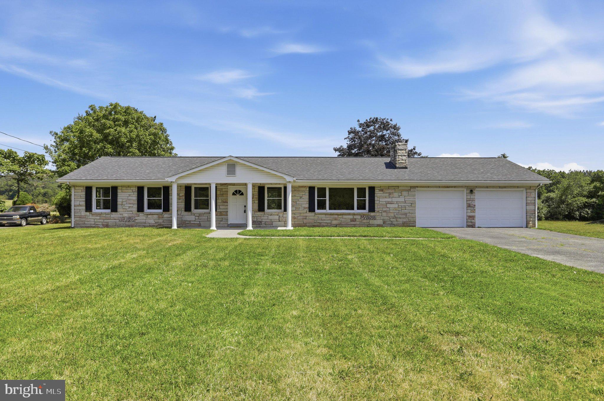 Beautifully renovated and move-in ready, this exceptional 3-bedroom, 2-bath ranch home sits on a picturesque 1-acre lot in the desirable southern part of the county, offering an ideal commuter location with easy access to Winchester, Virginia.

Featuring approximately 1,920 square feet of main-level living space plus an additional 900 square feet of finished basement, this home provides plenty of room for everyday living, entertaining, and working from home. The main level showcases beautifully refinished hardwood floors, fresh paint throughout, updated lighting fixtures, and generously sized bedrooms, including a spacious primary suite with a private en-suite bath.

The kitchen is both stylish and functional with new appliances, tile countertops, and a tile floor. The finished lower level offers endless flexibility for a family room, recreation area, home office, or fitness space and is conveniently accessible by both the interior staircase and a separate staircase from the oversized attached two-car garage. An additional 1,000 square feet of unfinished basement provides abundant storage or the opportunity for future expansion.

Outside, you'll find a fully fenced backyard, perfect for pets, children, and outdoor entertaining. Car enthusiasts, hobbyists, and anyone needing extra workspace will appreciate the oversized attached two-car garage, along with a detached two-car garage featuring a large workshop. Two separate driveways provide ample parking for multiple vehicles, trailers, RVs, or recreational equipment.

Additional improvements include a new electrical panel, fresh interior paint, updated lighting throughout, and numerous renovations that make this home truly move-in ready.

Offering the perfect combination of updated finishes, generous living space, outstanding garage and workshop options, and a highly convenient location, this is a rare opportunity to own a beautifully updated home with room to grow. 

Agent is Seller