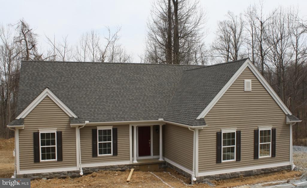 For Comp Purposes Only. Photo of similar ranch home to be built by Custom Home Group.