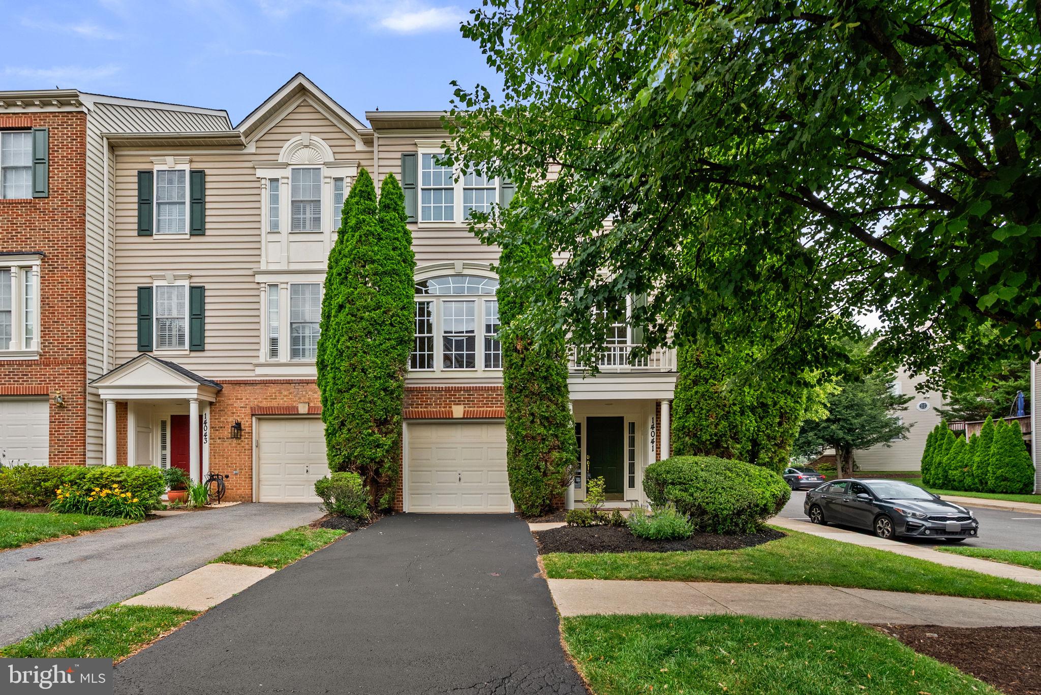 Welcome to 14041 Rockingham Road, a beautifully maintained end-unit townhome located in the sought-after Kingsview Village community of Germantown. Offering 3 bedrooms, 2 full baths, 1 half bath, and a one-car garage, this home combines comfortable living spaces with an excellent location.

The lower level features a spacious recreation room highlighted by a cozy gas fireplace, powder room, garage access, and a level walk-out to the rear yard—perfect for everyday living, entertaining, or relaxing at the end of the day.

The main level offers hardwood flooring throughout, a large eat-in kitchen with ample cabinet and counter space, and direct access to a private deck, creating an ideal setting for outdoor dining and relaxation.

Upstairs, the primary suite features vaulted ceilings, a walk-in closet, and a private bath with double vanity, soaking tub, and separate shower. Two additional bedrooms and a second full bath complete the upper level. Fresh paint throughout the interior and exterior, along with brand-new plush carpeting on the bedroom level, make this home truly move-in ready.

Residents of Kingsview Village enjoy access to community amenities including a swimming pool, tennis courts, and tot lots. Conveniently located just minutes from the Maryland SoccerPlex, Discovery Park, shopping, dining, and major commuter routes including Great Seneca Highway, Route 118, and I-270.