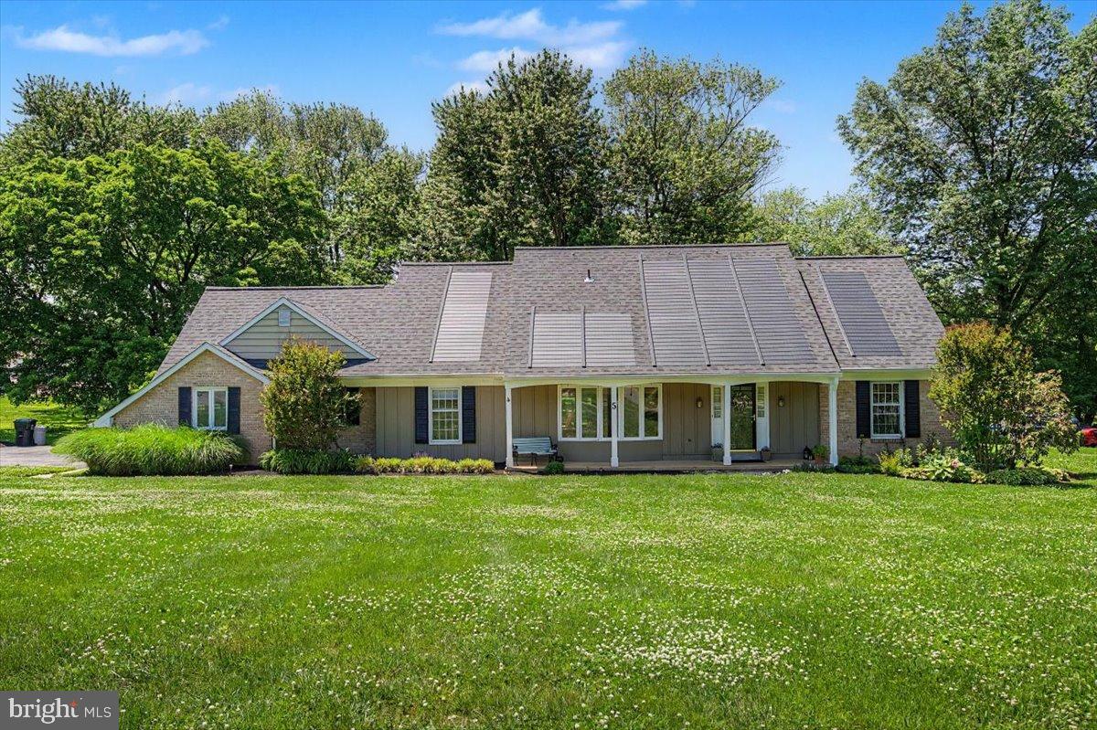 Gorgeous property in popular Tenby Chase, a lovely neighborhood of custom built homes in the Red Clay School District close to everything the Newark and Hockessin communities offer! This spacious 4 Bedroom home features an Open Floor Plan, many Updates, generously sized rooms, First Floor Primary Suite with full bath, and a Large Level Lot on almost an acre. A charming covered front porch greets you and leads to a wide foyer with hardwoods that continue throughout the main and upper levels. The heart of the home is the open concept family room/kitchen/sunroom, offering a perfect area to entertain or enjoy everyday living. A spacious family room has gorgeous built-in cabinetry on each side of the wood-burning fireplace, and the sunroom features vaulted ceilings, skylights, and 6 sets of sliders for beautiful views of the backyard. The beautifully renovated kitchen features solid oak cabinetry, sleek granite countertops, stainless appliances, center island, and a spacious dining area with sliders to the large deck and backyard. And there's more... a large living room/dining room has wide bay windows and offers additional living space, and a bonus room off the kitchen is ideal for a workout room, playroom, or office, with built-in cabinetry/pantry for additional storage. A convenient laundry/mudroom and powder room complete the main level and are easily accessed from the turned garage entryway. Hardwoods lead to the upper level that features 3 additional nicely sized bedrooms, a full bath with tub/shower, many spacious closets, and another bonus room that could be an office, study room, home gym, your choice! Outside, you'll appreciate the beautiful lot with mature trees and privacy, and the long driveway for ample parking. Imagine the possibilities! Additional updates include a New Roof and Skylights in 2023, a whole house water filtration system in 2019, and GAF Timberline Solar panels(owned with warranty). Ideally located in the North Star Feeder in a charming community convenient to all employers, schools, roadways, restaurants, shopping, recreation areas and more. Don't miss the opportunity to make this your new home sweet home!