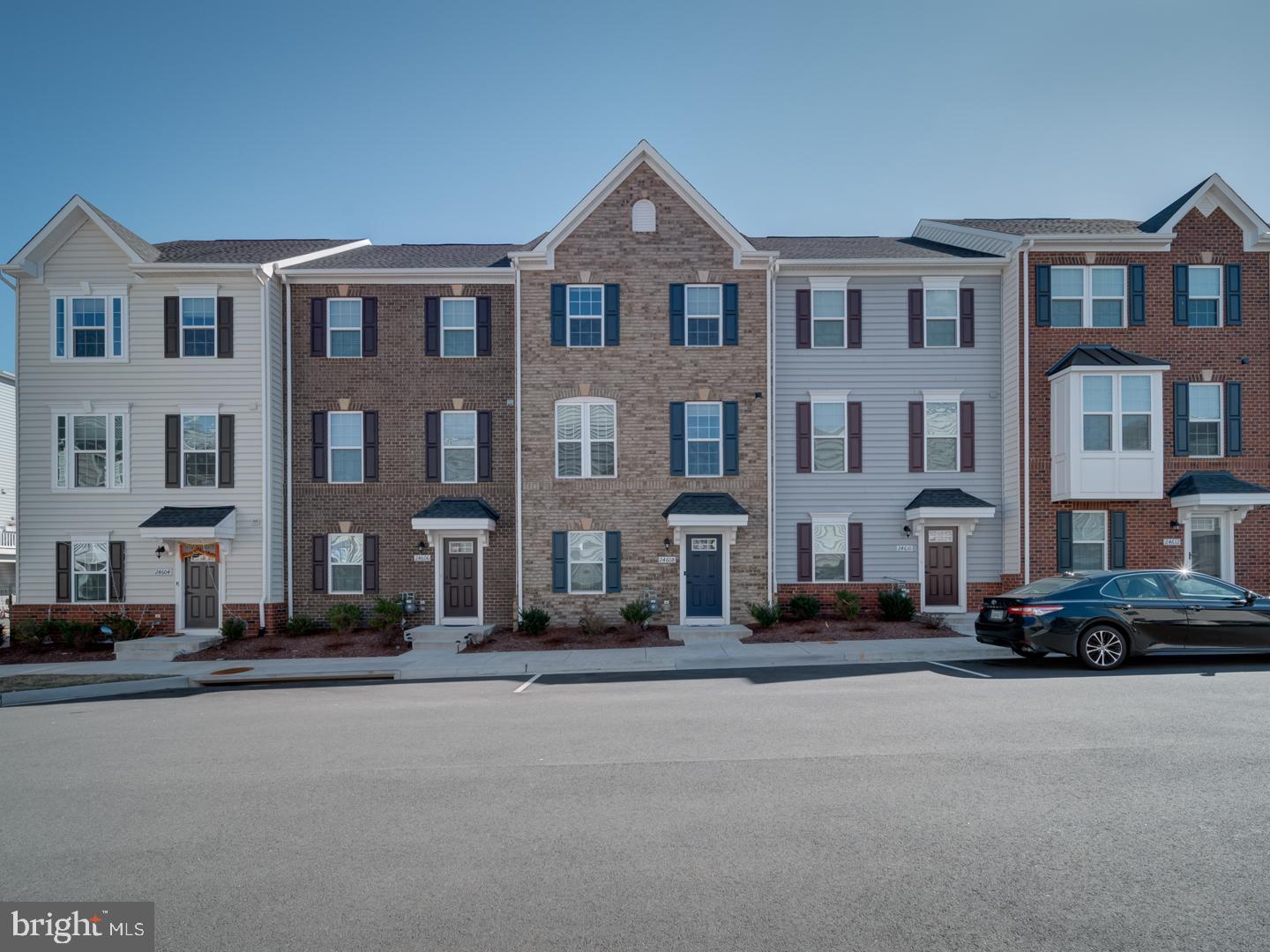 Welcome home to this impressive, brick-front townhome in the heart of Loudoun County! This 4-year young home boasts 4 levels, providing an abundance of space and privacy.  The light-filled main floor features beautiful LVP flooring throughout the open floor plan kitchen, living room and dining room. You will feel like a Chef in your own home ,in the stunning kitchen featuring SS appliances, Quartz countertops and a sizeable center island that provides additional storage and seating.  A half bathroom and access to the spacious deck completes the main level. Two secondary bedrooms are on the third level, as well as a hall bath and laundry room. A relaxing primary suite is also on this level, featuring a large walk-in closet and spa-like bathroom, complete with dual sinks, walk-in shower and soaker tub.  Do you need more space? How about two more fully finished levels! The first floor features a bedroom with attached full bathroom, serving as the perfect guest suite. The fourth level features another bedroom with attached bathroom, and access to its own private balcony.  Both rooms can easily be converted to a media room, den, playroom, office, etc. The possibilities are endless! Seller may need rent back. Washer and dryer not included. $2500 credit if financed with CMS Mortgage.