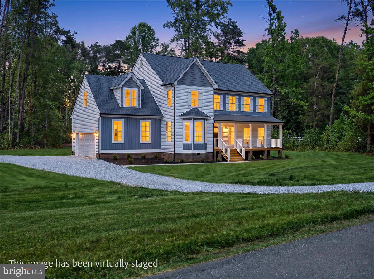 Designed for buyers who want space, style, and a true lake lifestyle without sacrificing comfort, 32 Mill Run delivers a rare combination of luxury finishes, massive square footage, and private lake access with covered boat slip A27 included.
Built by Danaf Homes, this move-in ready Lakeview model sits in the Mill Run community on the private side of Lake Anna and brings together refined design with the kind of everyday functionality buyers wish more homes actually had.
From the moment you pull in, the home makes an impression. Crisp architectural lines, upgraded exterior finishes, a welcoming covered front porch, and a wooded backdrop create a setting that feels private, polished, and substantial.
Inside, the scale of the home immediately stands out. The main living areas were designed to feel open, bright, and connected, with oversized windows, luxury vinyl plank flooring throughout, upgraded trim work, and a seamless flow built for both entertaining and everyday living. The kitchen anchors the home with an oversized quartz island, farmhouse apron-front sink, double wall ovens, upgraded cabinetry, walk-in pantry, and an incredible amount of prep and storage space that most new construction homes simply do not offer.
The great room feels expansive yet comfortable, centered around a gas fireplace with custom surround details and direct access to the outdoor living space. A separate flex space with French doors offers endless possibilities for a private office, formal dining room, media room, or additional lounge space depending on how you live.
Upstairs, the primary suite feels more like a private retreat than just another bedroom. The spa-inspired bath features upgraded tile selections, oversized glass shower, dual vanities, matte black fixtures, and elevated finishes throughout. Secondary bedrooms are generously sized, and the massive upper-level recreation space gives flexibility for guests, bunk room setups, game nights, fitness equipment, or a second living area. It is the kind of bonus space people walk into and instantly start planning how they would use it.
And then there’s the part that makes Lake Anna living what it is. Covered boat slip A27 gives you direct access to the private side of the lake for long weekends on the water, quiet morning cruises, tubing days with friends, and sunsets that somehow never get old.

This is not builder-basic. It is a thoughtfully upgraded luxury lake-access home with the size, layout, and lifestyle today’s buyers are chasing, without the wait of new construction.

32 Mill Run gives you the space to spread out, the upgrades people actually want, and the kind of lake life that feels easy the second you arrive.