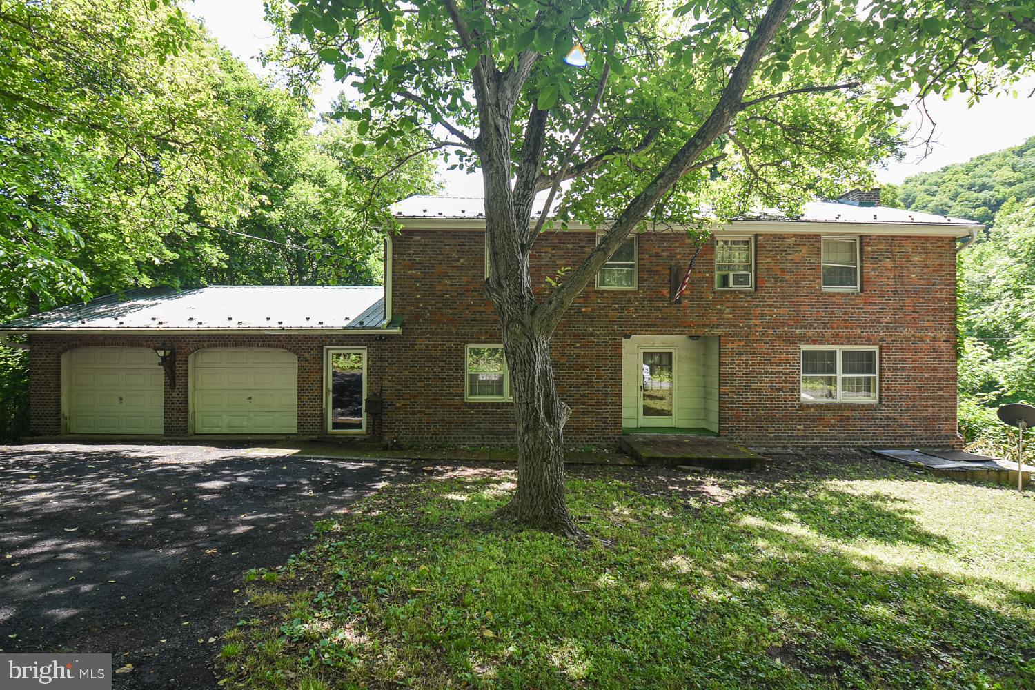 3 beds, 1 bath, 2 car attached garage w/ automatic openers!  FULL unfinished walk-out basement!  FIRST FLOOR laundry!  MASSIVE living room with hardwood floors!  HUGE front bedroom that spans the entire length of the house!  The foundation is in need of repair, being sold strictly as-is.