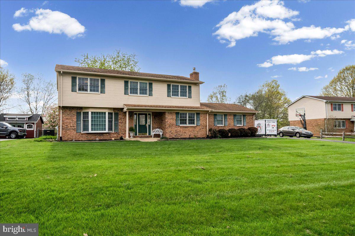 Big Price Reduction!!! Someone is getting a deal!! This a nice house!!! Just a fantastic house and location in Caravel Farms! Tucked back into the cul de sac, with .53 acre,  4 bedrooms, 2.5 baths, immaculate colonial is in move in condition and ready for a new owner.! The eat in kitchen is newer,  with granite counters, tile backsplash and ceramic tile flooring. There is a formal living room and dining room, with fresh, neutral paint and  gleaming hardwood floors. The big family room comes right off the kitchen, featuring more beautiful hardwood floors, brick gas fireplace and a main level laundry area with upper cabinets and powder room with linen closet. Exit to the screened porch, and cement patio overlooking a just gorgeous, flat, fenced rear yard with mature landscaping! Upstairs to the primary suite, with an updated primary, private bathroom, big walk in shower and 2 closets, 1 walk in! The additional 3 bedrooms are big, and all have the same really nice hardwood floors and fresh neutral paint! The basement is partially finished,  and there is also plenty of room for storage and utilities! There is an attached 2 car garage with man door, and a brand new driveway. The HVAC was new  in 2023 as well!! This is a wonderful home, in a great spot, close too all major highways, across from Caravel Academy, restaurants and shopping centers!