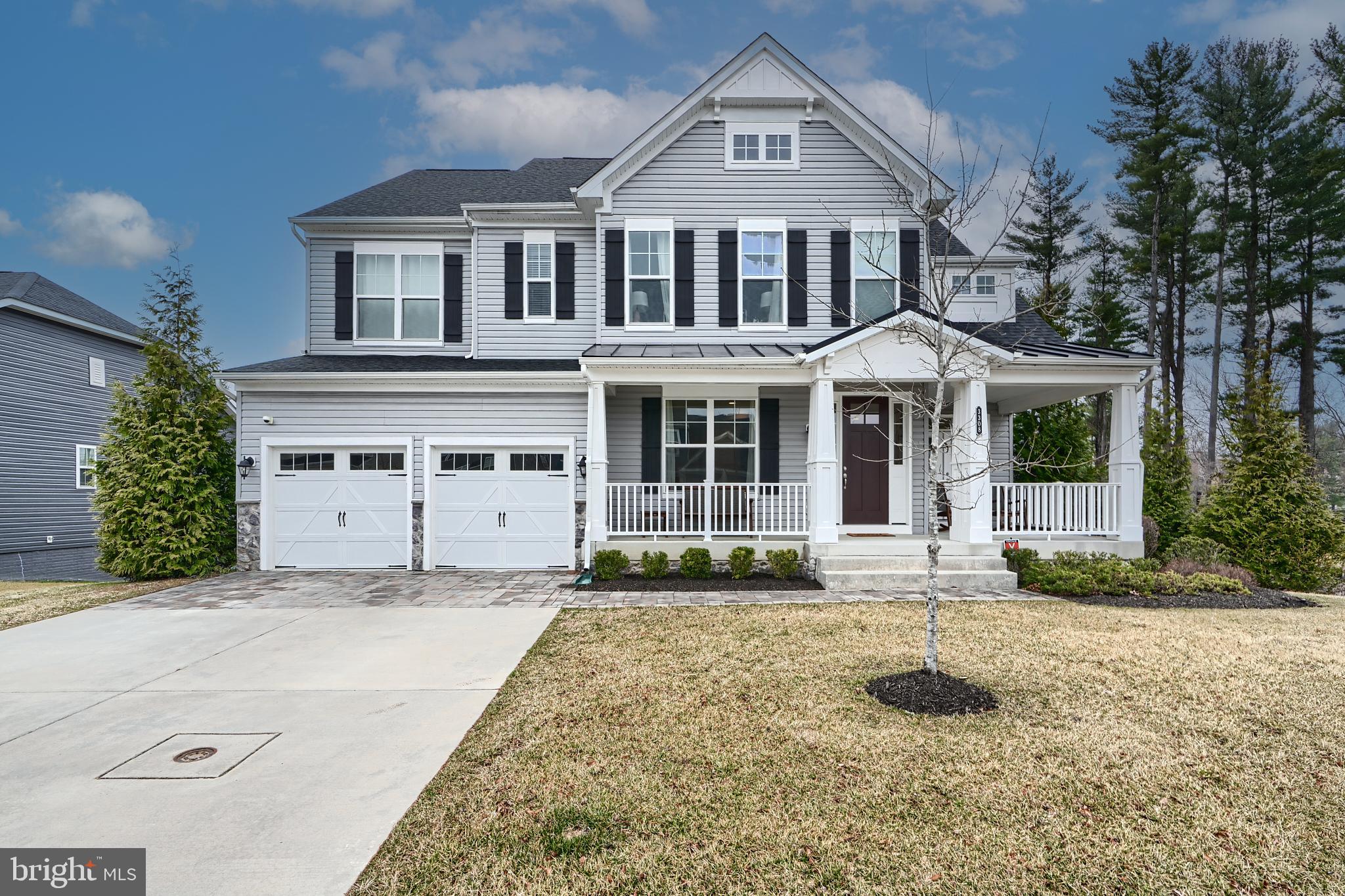 This beautifully designed home was the Model Home for this charming, recently built community of 32 luxury houses.  Warm and welcoming describe each light filled room from the grand high ceiled foyer to the landscaped surroundings. The gourmet kitchen features an expansive island, 2 sinks, 2 dishwashers,  a 5-burner gas cooktop and a high-end KitchenAid double wall oven/microwave (Energy star rated). Perfect for entertaining, the open concept floor plan includes a large breakfast/eat-in area and a great room flanked by an inviting gas fireplace. The private dining room ​overlooks the cozy sitting area, leading back to the entrance​ and open office area. The second floor bedrooms and full baths are equally charming and roomy. Networked for any large screen or other technology​, the grand primary bedroom opens to a sitting area and spa bathroom. The laundry room is conveniently located on the same level.   Whirlpool washer/dryer and a separate Whirlpool dryer. No absence of light or space in the bottom club level either.  Make it into an extra family area or home theater room. Another bedroom and full bathroom can be used for in-laws or a nanny. Full house music wired and zoned to play your choice of any streamed music.  Looking for curb appeal and outside enjoyment? Check out the cozy front porch, the main level deck and ground level paved patio — all surrounded by conserved green spaces. Convenient location with easy access to nearby major travel routes, shopping, walking paths, trails and tree lined streets. As the model home it is filled with almost all the available upgrades, including upgraded cabinets and tile backsplash in the kitchen, upgraded carpet, stair runner, a full security system with 6 cameras and a video doorbell, trex deck on the back, and a programmable lawn irrigation system. All art and furniture were part of the model home, and are also available to be conveyed separately to keep the designer look of the house.  Investigate your options to assume a low interest rate VA loan.  It may be assumable for the right buyer-possibly a non-Veteran as well.