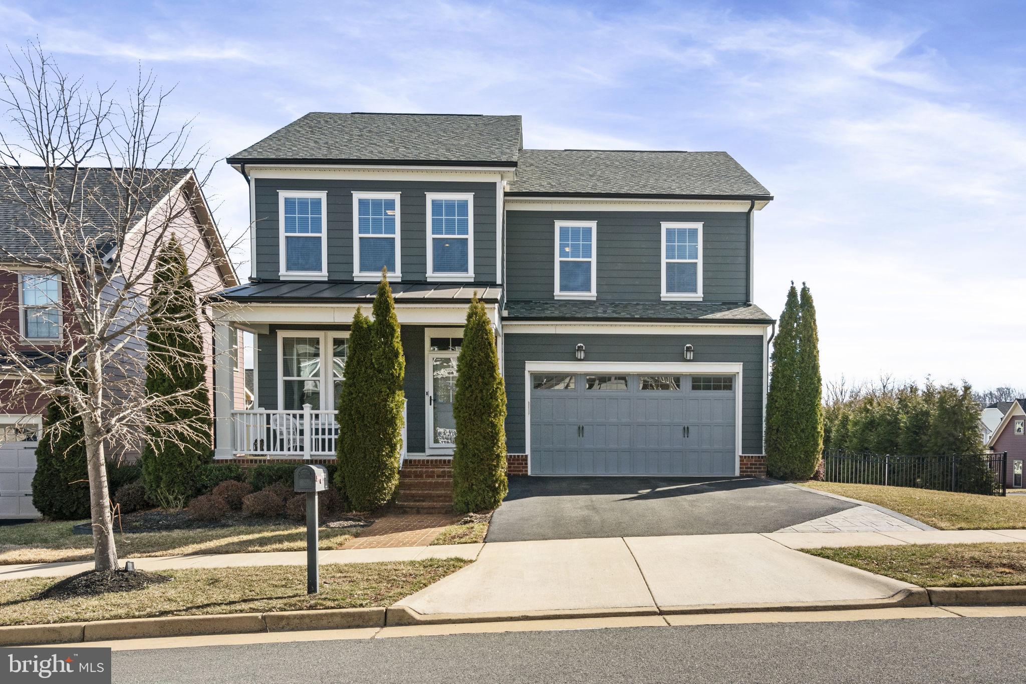 Beautiful Single Family Home with MANY custom features! This home features a large fenced corner lot allowing so much natural light to pour in. The custom features allow comfort & functionality to come together in this open-concept home. Upon entering you immediately notice the high ceilings, crown molding, large windows, freshly painted walls, and gleaming REAL  hardwood floors that flow throughout the main level. Off the family room is a beautiful open kitchen with a very large working island complete with granite countertops, linen cabinets, and stainless appliances. The main level comes with a mud room off the two-car garage for easy access and storage items. As you make your way upstairs, the primary suite is to the right, and the UPDATES include newly installed hardwood floors,  Custom floor to ceiling built-in TV/Desk area, a large, walk-in ORGANIZED  CUSTOM closet system, and an updated AMAZING SPA-LIKE bathroom that you have to see for yourself equipped with custom rock floor in the shower, additional cabinets space, custom lighting, and jetted soaker tub! Additionally on this level are two other generous-sized bedrooms, an updated bath, and an upper-level laundry room complete with a washer & dryer. The lower walk-out level has a workout room, a fourth large bedroom TO CODE, and an en-suite full bath. The rec room is perfect for adult gatherings with a gorgeous bar also equipped with mini beverage fridge, and automatic ice maker, perfect for friends and family to entertain! This home includes over $130,000 in amazing upgrades including a custom deck and stamped concrete patio with connecting stairs that spill into the large corner lot with a fully fenced backyard, in-ground irrigation system, and professional landscaping. Make this your home and enjoy the world-class amenities that POTOMAC SHORES has to offer, including the state-of-the-art fitness facilities, Jack Nicklaus Signature Public Golf Course and Tidewater Grill, 2 swimming pools, social facilities, 5+ miles of walking trails, canoe/kayak launch and well planned and extremely well-attended community activities. Both the elementary (Covington-Harper) and Potomac Shores Middle school are located within the community as well as John Paul The Great private high school and the Ali Krieger Sports Complex. A VRE station construction has begun, and the town center are underway. The combination of this beautiful home and all the amenities available in Potomac Shores, makes this a wonderful place to call home!