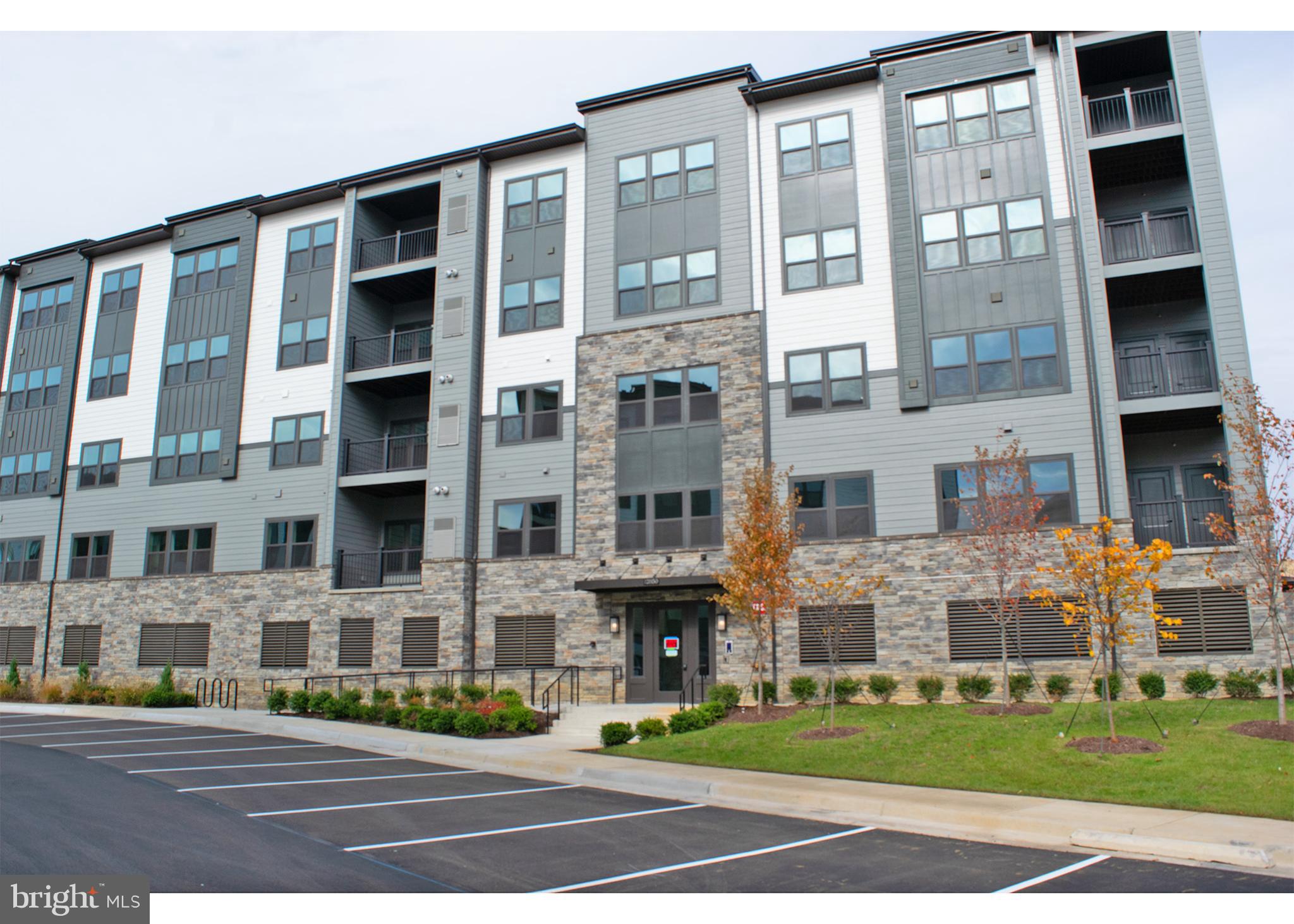 Beautiful 2 bedroom 2 bath condo located in the heart of Herndon. Featuring upgraded kitchen with stainless steel appliances and granite counter tops. Spacious living area with luxury flooring and lots of natural light. Primary bedroom features walk in closet and private en suite. Covered balcony with privacy included. Home in conveniently located close to major highways and public transportation. Includes one covered garage parking space. A Must See!!!