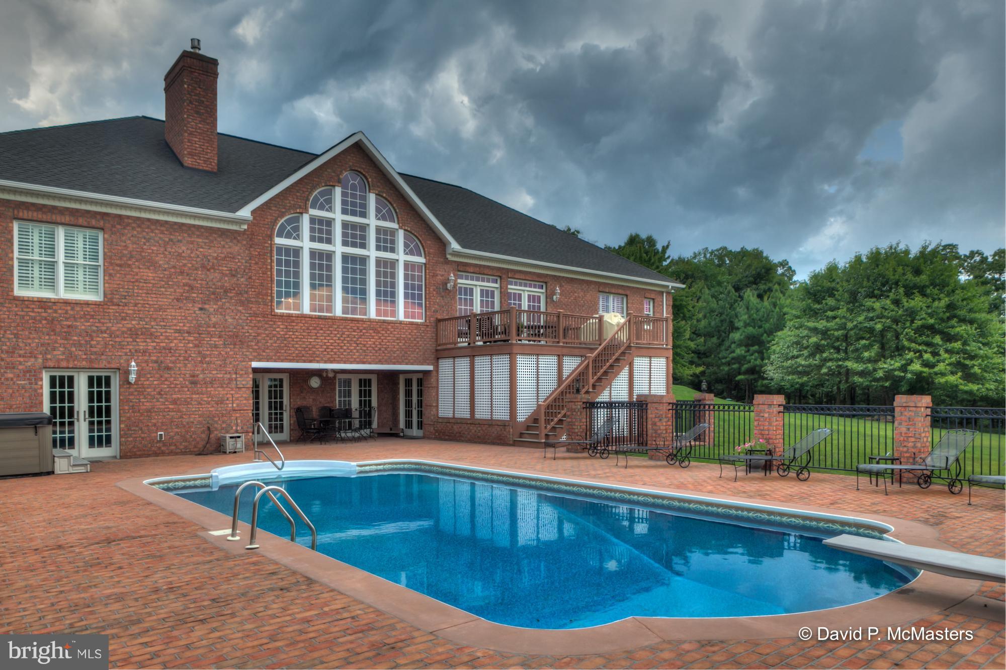 Truly exceptional brick rancher with big finished basement and inground pool in gated community.  Bring the chickens and the cows. HORSE BARN, paddocks, in-ground pool  18x36. 2 Fire Places, 8p hot tub.   Mountain views.  Huge master suite w/ built-ins.  Gourmet kitchen, granite. GREAT BASEMENT w/wet bar, huge rec room, FP, built-ins. Entire home is  gorgeous, highest quality materials, immaculate. Peaceful & pleasing to the eye, inside and out.  12 min to I-81, 20 to MARC Commuter Train to DC. BIG PRICE DROP. Absolutely Stunning. Just for fun, we just added some lovely Christmas decoration photos.