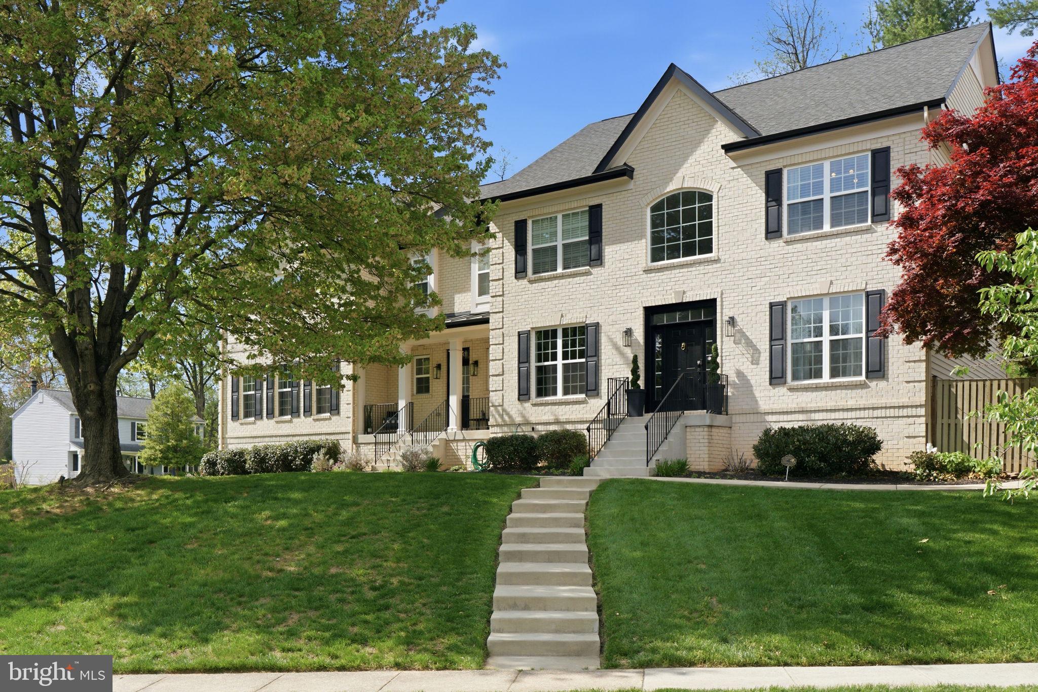 New Price Improvement! Perfectly positioned in Old Farm, known for its cherry blossom tree-lined streets, neighborhood park and pool, and easy access to Pike & Rose, Park Potomac, Bethesda, and Washington, D.C., 11801 Dinwiddie Dr offers the rare combination of space, style, and location.
This home offers a refined take on classic colonial architecture with thoughtfully modern living throughout. Built by the renowned Classic Homes of MD in 2017, this stunning center hall Colonial blends timeless design with high-performance systems and luxurious everyday comfort. Inside, oversized windows, crown moldings, and durable LVP flooring create a bright, polished backdrop across the home’s beautifully scaled interiors. A grand two-story foyer with a walk-in coat closet sets the tone, flanked by a formal living room on one side and an elegant dining room on the other, complete with classic wainscoting. A main-level bedroom offers flexibility as a private guest suite or the perfect work-from-home office. 
At the heart of the home, the dramatic family room features vaulted two-story coffered ceilings and a gas fireplace, opening seamlessly to a spectacular eat-in chef’s kitchen designed for both everyday living and effortless entertaining. A large center island anchors the space, while stainless steel appliances include double dishwashers, an induction cooktop, wall oven, convection microwave, and full refrigerator/freezer. A walk-in pantry, wet bar with beverage center, and generous space for an informal dining table complete the kitchen. Sliding glass doors lead directly to the backyard retreat. The main level also includes a powder room, a mudroom with built-in storage, and a full bathroom with a secondary laundry—perfect for pool towels after a swim. The oversized three-car garage offers tall ceilings suitable for car lifts and built-in storage, along with a kegerator setup for entertaining.
Upstairs, four bedrooms and three full baths include the expansive primary suite, along with the home’s main laundry room. The primary suite is a true retreat, featuring two walk-in closets, a sitting room, and a spa-inspired bath with a soaking tub, walk-in steam shower, dual vanities, and exquisite tile work highlighted by a mosaic “tile carpet.” A recirculating pump ensures near-instant hot water. The walk-up lower level adds even more living space with a large recreation room with access to the back patio, an additional bedroom and full bath, a bonus room with ceilings tall enough for a golf simulator, a dedicated fitness room, and ample storage. 
Outside, the fully fenced backyard feels like a private resort. A heated in-ground saltwater fiberglass pool with two waterfalls anchors the space, complemented by a patio for lounging and entertaining, a storage shed, and a sports court with a basketball hoop. Additional features of this stunning home include a dual access staircase, two hot water heaters, two-zone HVAC with Nest controls, Cat 5 wiring for TVs, smart lighting in select rooms (family room, primary bath, and second-floor office), smart locks throughout, indoor sprinklers, oversized gutters with guards, motion-sensing exterior lighting, and pet- and stain-resistant carpeting.