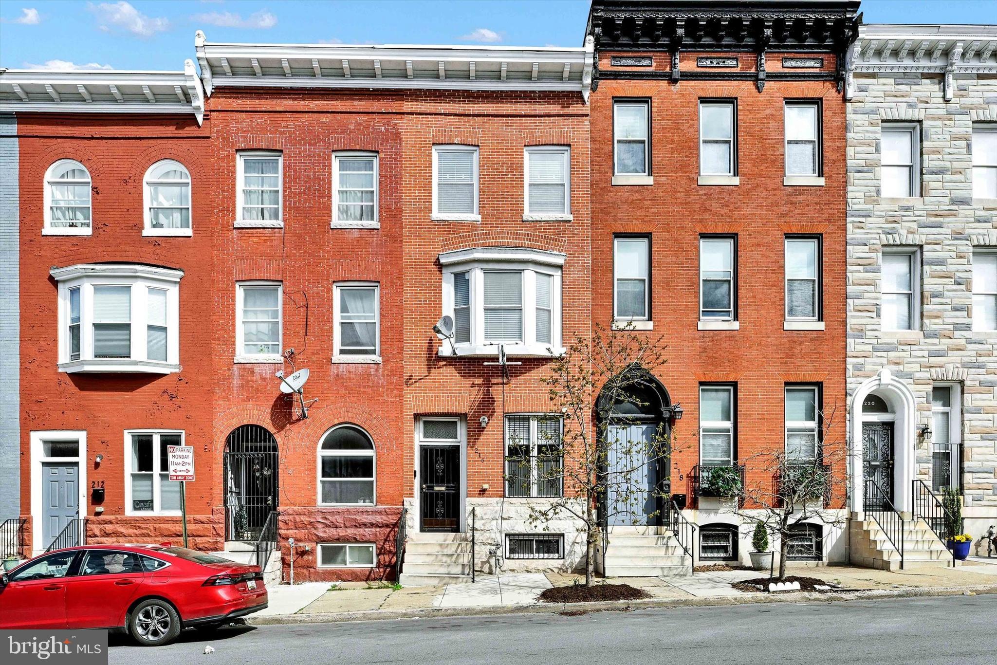 Style and convenience unite in this beautifully renovated four level home in Greenmount West. Exposed brick and hardwood floors greet you as you enter the open concept first floor complete with high ceilings, stainless steel appliances, granite countertop, a half bath and an attached climate controlled garage (or flex space). Up one level, you’ll find a cozy primary suite with a spacious bathroom, separate jetted tub and shower, dual vanities and balcony as well as a light filled family room and convenient laundry room. The top level contains two additional bedrooms and full hallway bathroom with dual vanities. Sliding doors open to a raised deck that overlooks all of northern Baltimore City. The basement is primed for additional finished space with a rough-in for another bathroom. Out back, you’ll find a gated parking pad for recreation or additional parking. The house backs to the 3/4 acre Hidden Harvest Farm, an urban community garden/green space. Updates include a two zone HVAC system, modified Bitumen roof system and composite Fiberon roof deck. Enjoy prime city living with Penn Station and University of Baltimore just a short walk away along with restaurants, cafes, bars, theaters, cultural attractions and so much more.