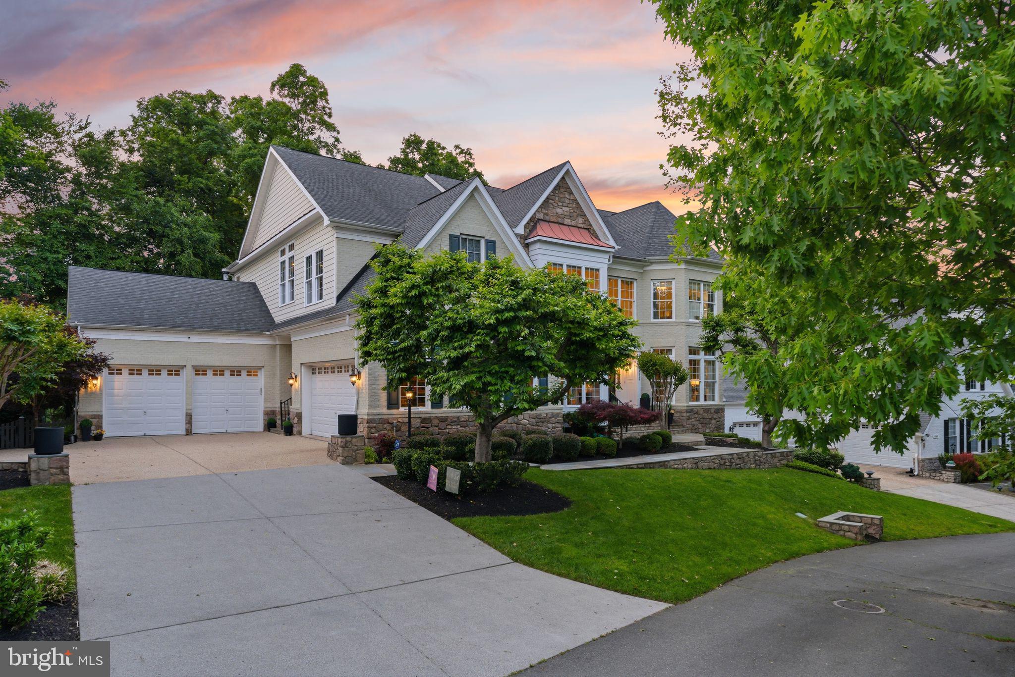 Open House Sunday June 14th 2pm - 4pm**Designer's Home with Premium Lansdowne Living on Goose Creek. Positioned at the end of a cul-de-sac on one of the most coveted streets of Lansdowne on the Potomac, this sought-after Van Metre Knoll model sits on a third-acre lot backing to mature tree privacy and the creek itself, with west-facing sunsets off the back of the home and a private pathway leading from the yard down to hiking trails and a canoe and kayak launch. Enjoy a four-car garage, grand-scale rooms, and designer-level updates throughout. Inside, a two-story foyer opens to sweeping stairs, a private home office, and a sunlit formal living room. The adjoining formal dining room offers flexibility for entertaining or everyday use, with elegant moldings, updated lighting, and a flowing floor plan that carries through the main level. An updated butler’s pantry leads into a fully renovated chef’s kitchen, showcasing gleaming white cabinetry and countertops, quality stainless appliances, abundant storage, and a generous island built for casual meals and conversation. The vaulted sunroom just beyond opens directly to the deck for an easy indoor-outdoor flow, with wooded views in every direction. The family room continues the open layout, with a fireplace and three soaring arch-topped windows. Two updated powder baths sit conveniently near the front entry and mudroom. Upstairs, rich hardwoods give way to new carpet in the private quarters. The primary suite occupies its own private wing with tray ceilings, a sitting area, dual walk-in closets, and a spa-style bath featuring a jetted soaking tub, passthrough shower, and double vanities. An adjoining bedroom works beautifully as a nursery, office, or yoga space and connects through a Jack-and-Jill bath to a third bedroom. Two more upper bedrooms share their own updated Jack-and-Jill bath. The lower level walks out to the patio and features a gorgeous renovated rec room with high-end LVP chevron flooring, designer lighting, and a fully equipped bar. This level also hosts a home theater room, a bonus room, a full bath, and a large bedroom with walk-in closet and full windows for a true guest or multigenerational suite. Outside, the fenced backyard offers multiple patio spaces, a covered area for shade, and a fire pit, all set against a lawn that backs into the trees. The expansive deck off the main level is built for grilling and gathering above the canopy. Recent improvements include the remodeled kitchen (2023), full basement renovation and new water heater and sump pump (2021), new HVAC with warranty through 2029 (2024), reimagined outdoor spaces with new deck, patio, fence, fire pit, and walkway stairs (2022), main-level flooring, mudroom built-ins, and basement media room (2017), washer and dryer (2020), dishwasher (2021), yard irrigation, refreshed bathrooms with new paint, lighting, sinks, hardware, and toilets, custom light fixtures throughout, and over twenty newly planted trees with custom flower beds. Lansdowne amenities include indoor and outdoor pools, a fitness center, playgrounds, sport courts, aerobics rooms, a ballroom, business center, and more, with Riverside High, Belmont Middle, the community playground, and tennis and pickleball courts all close by. Route 7, Lansdowne Town Center, the Golf Club at Lansdowne, Lansdowne Resort and Spa, One Loudoun, and Bazil Newman Riverfront Park are all within easy reach. A rare combination of privacy, scale, and a very special location, in one of Northern Virginia’s most distinguished communities.