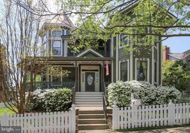 STUNNING Kentlands Queen Anne Victorian home with all the details of a classic Victorian including large wrap around front porch with swing.  Very generous and cozy floor plan with hardwood through out main and upper levels, .main floor office, open living room, very large dining room connected by butlers pantry and laundry room to the VERY LARGE kitchen with granite, stainless steel appliances island/breakfast bar, gas cooktop, large table space area, built in desk area and walk out to rear deck and gazebo and 2 car detached garage.   Oversized Main BR with separate sitting area with vaulted ceiling, walk out to deck, trey ceiling and large walk in closet. Renovated Main Bathroom with stand alone tub and walk in shower.  SPACIOUS finished walk up basement with laminate wood flooring and tons of storage.  Short walk to Kentlands pool/club house, tenning, b-ball, paddle.   ** We have an in-house Maint Dept for QUICK repair response/ 24 hrs emergency.  * AGENTS read the Agent Private remarks in BRIGHT MLS please !!! APPLY on our website under Avail Rental/Apply Now.. ALL ADULTS must fill out an APP, you will be asked to upload a paystub and copy of drivers license in the app, so best to have those ready on desktop before applying.