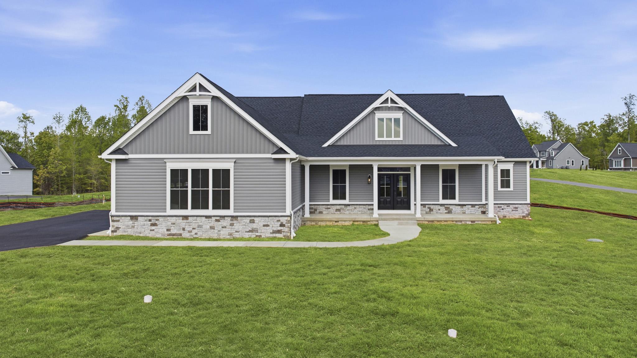 AVAILABLE FOR IMMEDIATE MOVE IN!! 
Custom-built rancher by third-generation builder Wilkerson Homes, set on a one-acre lot with a three-car side-load garage, turnaround driveway, and a 1,700 sq. ft. finished basement with full bath. Enjoy sunset views from this elevated homesite.
The front of the home features a stone water table and an oversized front porch with double doors that open to a foyer with crown molding. Off the foyer is a formal dining room or office with double doors. The great room offers vaulted ceilings and a floor-to-ceiling stone gas fireplace, opening to a gourmet kitchen with a tile backsplash, double convection ovens, gas cooktop with pot filler, and an oversized granite island. Additional highlights include a spacious walk-in pantry, mudroom with built-ins, and a centrally located laundry room with utility sink.
The primary suite features a tray ceiling with crown molding and a well-appointed bath with a freestanding tub, floor-mounted faucet, handheld sprayer, ceramic tile flooring, and an oversized tiled shower with rain head, wall-mounted shower head, and handheld sprayer. The suite also includes a private water closet with window and a large walk-in closet with custom wood shelving. Other features include rounded corners, lever door handles, transom windows, wood shelving in all closets, and a finished garage.
Visit the Wilkerson Homes website to learn more about standard features and one-acre minimum homesites, and to explore options for building your custom home. Welcome home to Wilkerson!
