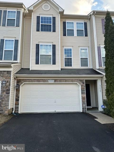 JUST REDUCED !!! Exquisite and Upgraded Van Metre Townhome inBrambleton Area, See Photos and Virtual tour above Sellers are flexible with closing date can be 30 days or more if needed.

This stunning North-Facing & Premium Lot backing to Trees area townhome offers an array of high-quality refinements and detailed upgrades, making it a true gem in the Brambleton community. The property features granite countertops, stainless steel appliances, and beautiful 42" cabinets in the beautiful bright and Spacious kitchen. Hardwood flooring graces the main and lower levels, enhancing the open floor plan that seamlessly flows into the living room, which is accented with wide molding and recessed lighting.

The primary bedroom suite boasts a tray ceiling, a large walk-in closet, and a spacious master bath with elegant tile work. The lower level includes a third full bath and a versatile recreation room that can easily be converted into a fourth bedroom. Enjoy outdoor living with a walkout basement a, a fenced yard, and a deck.

Additional highlights include:
5 different Pools around the area

Two-car garage with ample guest parking

Verizon 5G internet/ Cable TV included in HOA fees

Proximity to Brambleton Town Center, commuter routes, new Silver Line metro stops, and Dulles Airport

Enclave of townhouses on a cul-de-sac backing to a private wooded area

Community Amenities:
Tons of  Miles Walking common areas

Basketball courts

Community pond

Common areas

Outdoor pool
Nice Pond nearby

Recreation center

Tot lot
New Washer and Dryer & built in microwave.

Conveniently located and meticulously maintained, this property offers a perfect blend of luxury and practicality, making it an ideal choice for discerning buyers.