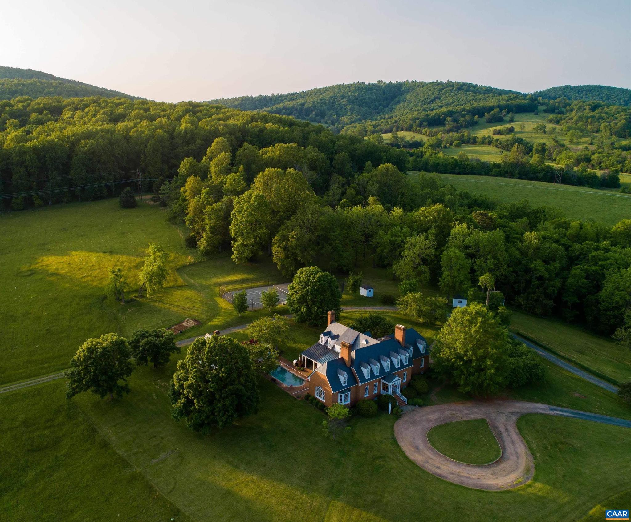 A 35-acre estate on the edge of Charlottesville in the heart of protected Keswick, Springdale House is a true opportunity to own a beautiful private estate across from Keswick Hall and minutes to downtown Charlottesville and the University.  The 6,200 square foot, well-proportioned residence sits perched on an elevated site overlooking a beautiful pond and the surrounding countryside.   The colonial-style brick residence offers hardwood floors and good proportions is complemented by a charming guest cottage, pool, and tennis court.  The home is surrounded by large estates. A rare opportunity to own a wonderful property in beautiful Keswick.,Painted Cabinets,Tile Counter,Wood Cabinets,Fireplace in Bedroom,Fireplace in Den,Fireplace in Dining Room,Fireplace in Family Room,Fireplace in Master Bedroom,Fireplace in Study/Library