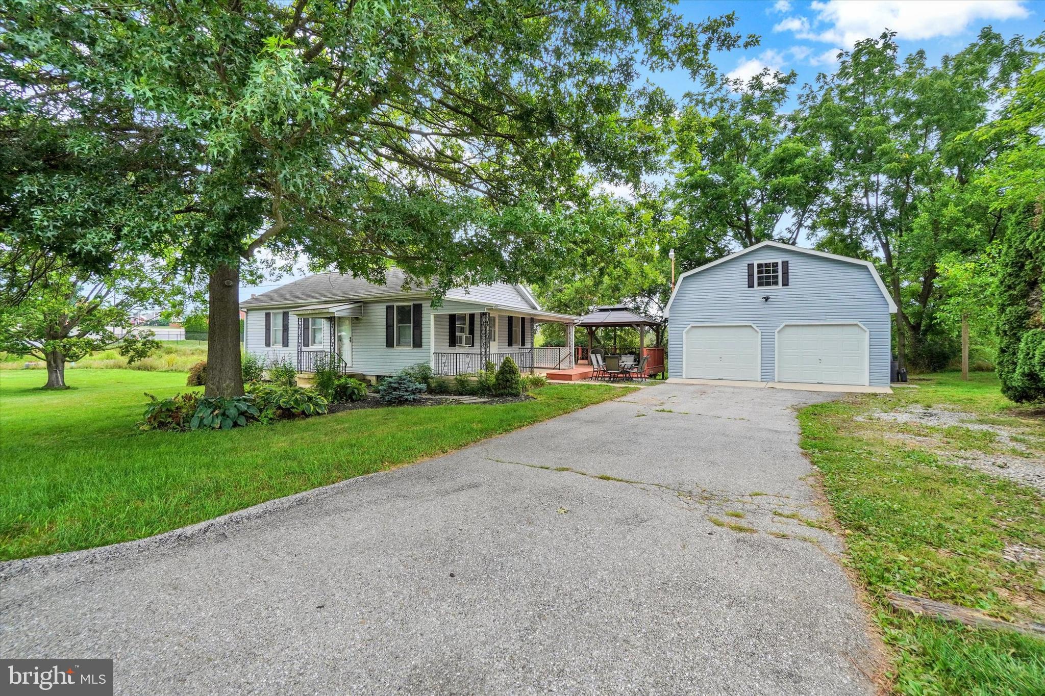 If you've been searching for a property where you can enjoy your own space and finally have the garage you've always wanted, this is the one! This ranch-style home is ideal for those who appreciate a little more independence, whether you're a hobbyist, car enthusiast, woodworker, craftsman, or simply someone who enjoys having room to tackle projects. Inside, you'll find a comfortable floor plan featuring an eat-in kitchen and a living room with direct access to a spacious rear deck, creating the perfect extension of your living space for outdoor dining, entertaining, or relaxing. A covered side porch provide yet another spot to unwind. The real star of the property is the incredible 2-story, 2-car, detached garage. The second floor, previously used as a game room, offers endless possibilities for a workshop, hobby room, studio, home office, fitness area, or additional storage. Whether you're restoring classic cars, building furniture, or looking for the ultimate place to pursue your favorite pastime, this versatile space is ready to accommodate your vision. Commercial zoning offers added flexibility and potential, while the location provides the convenience of being within walking distance of downtown Dover, Dover Area Middle School, and the Dover Township Municipal Building. With easy access to local amenities and a property that offers far more than meets the eye, this is an opportunity you won't want to miss.  Anderson double pane windows, updated metal roof that looks like asphalt shingle. AGENTS - Please read Agent Remarks.